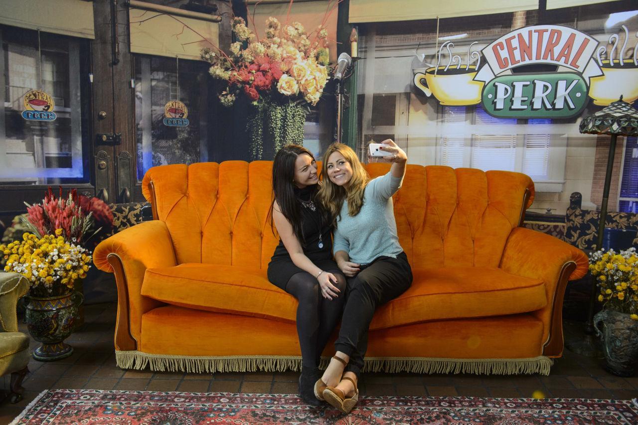 Fans take a selfie while visiting FriendsFest's own Central Perk