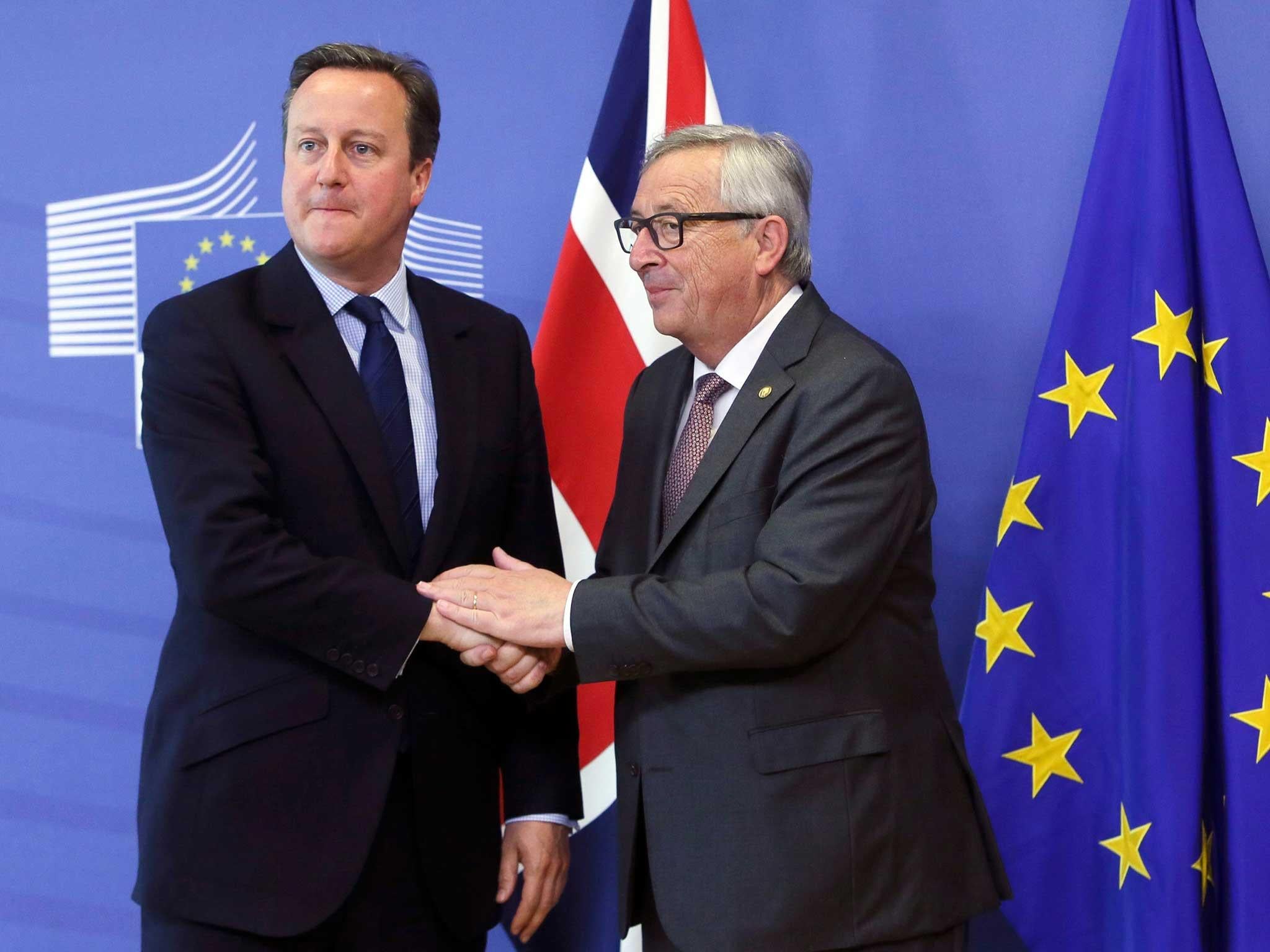 David Cameron is welcomed by European Commission President Jean-Claude Juncker prior to a meeting in Brussels