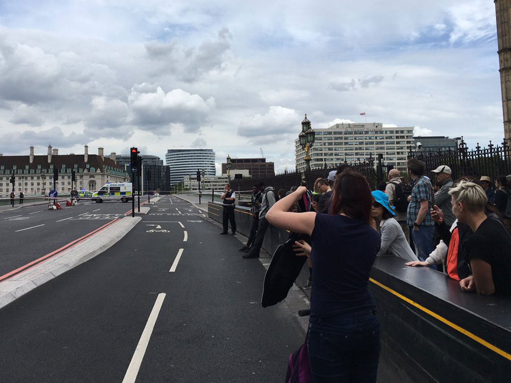 Tourists photographing the police investigation into a suspicious car on Westminster Bridge on 28 June