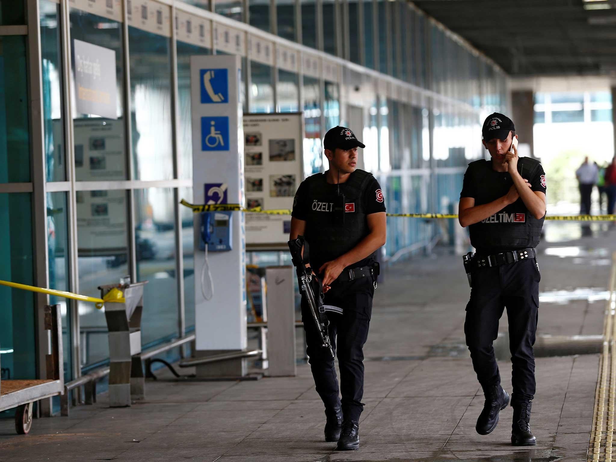 Officers patrol Ataturk airport near the site of Tuesday’s attack