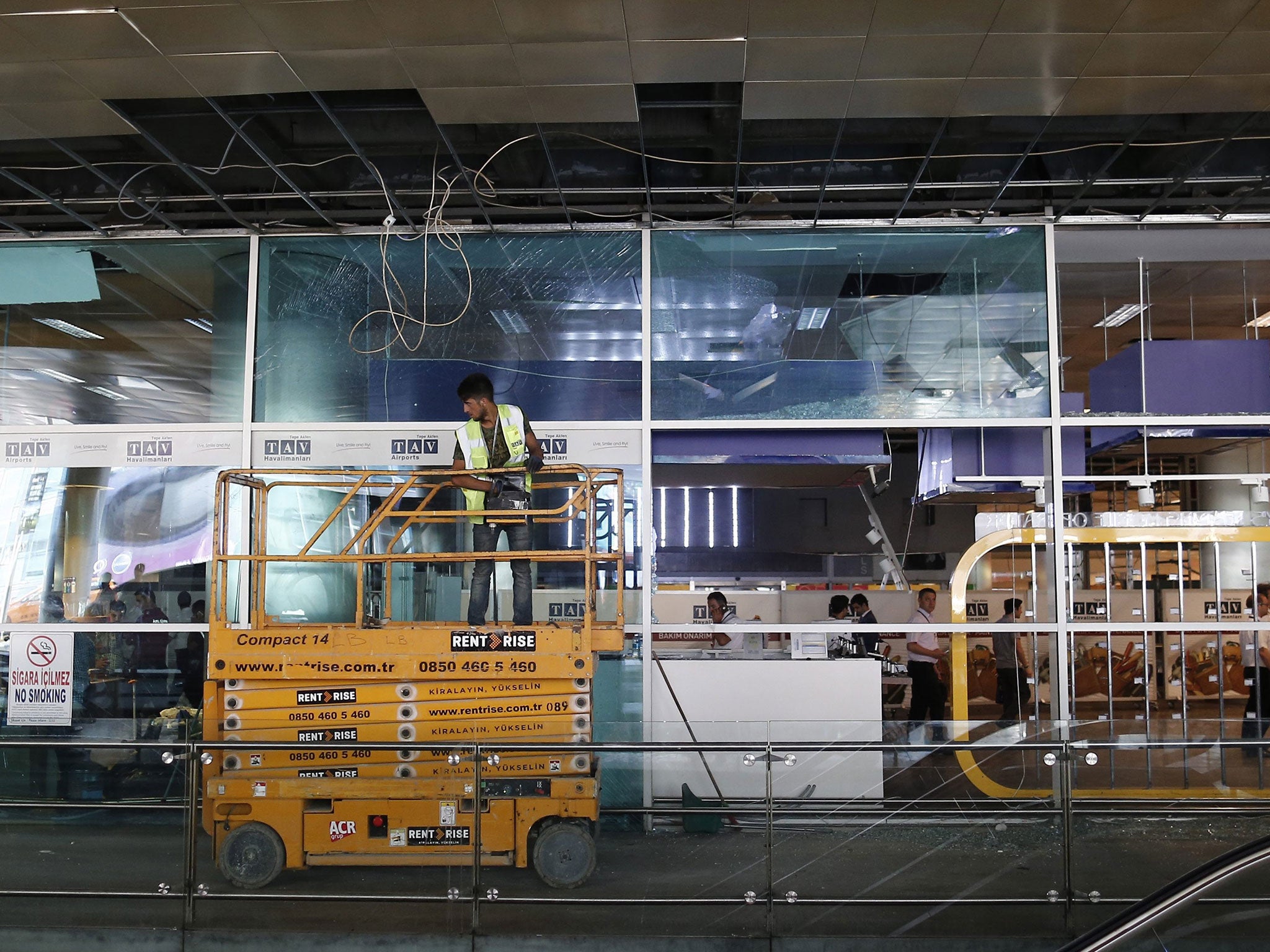 Turkish workers repair destroyed roof after multiple suicide bomb attacks at Ataturk international airport in Istanbul, Turkey, 29 June 2016