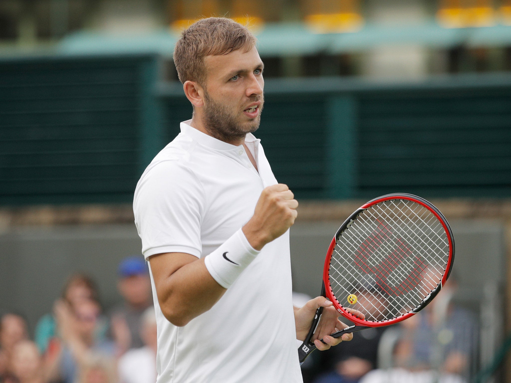 Dan Evans celebrates his 7-6, (8/6), 6-4, 6-1 victory over 30th-seed Alexandr Dolgopolov