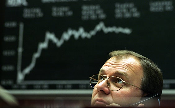 Traders deal on the trading floor of Germany's stock exchange Deutsche Boerse Group in Frankfurt