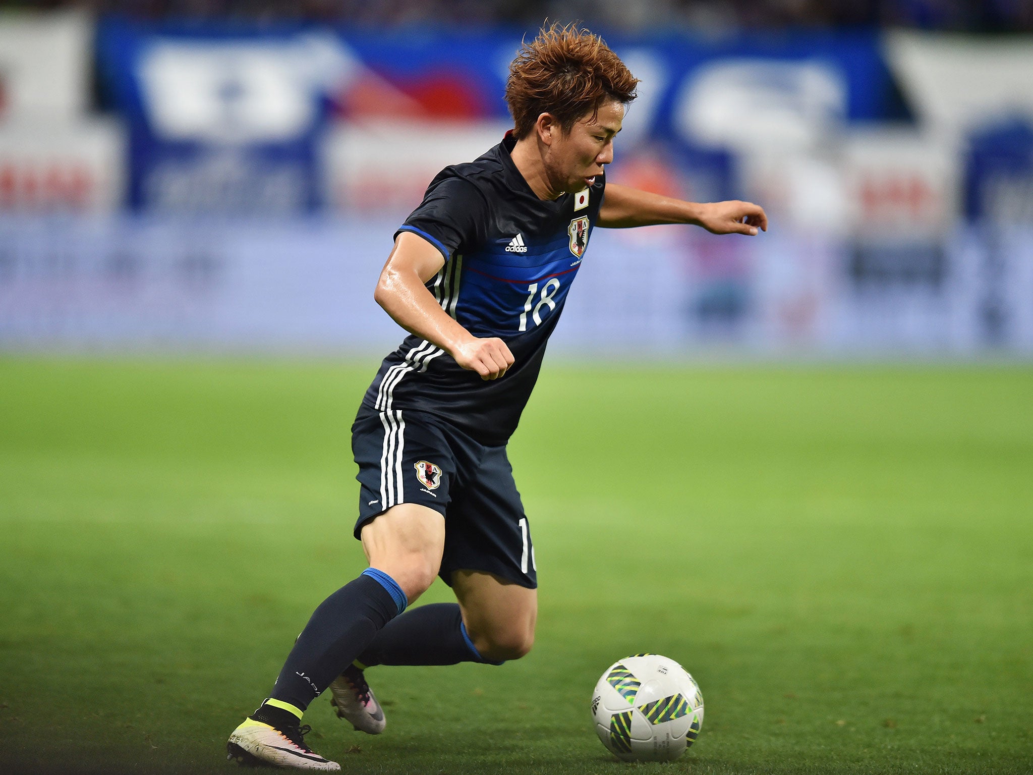 Takuma Asano in action for Japan