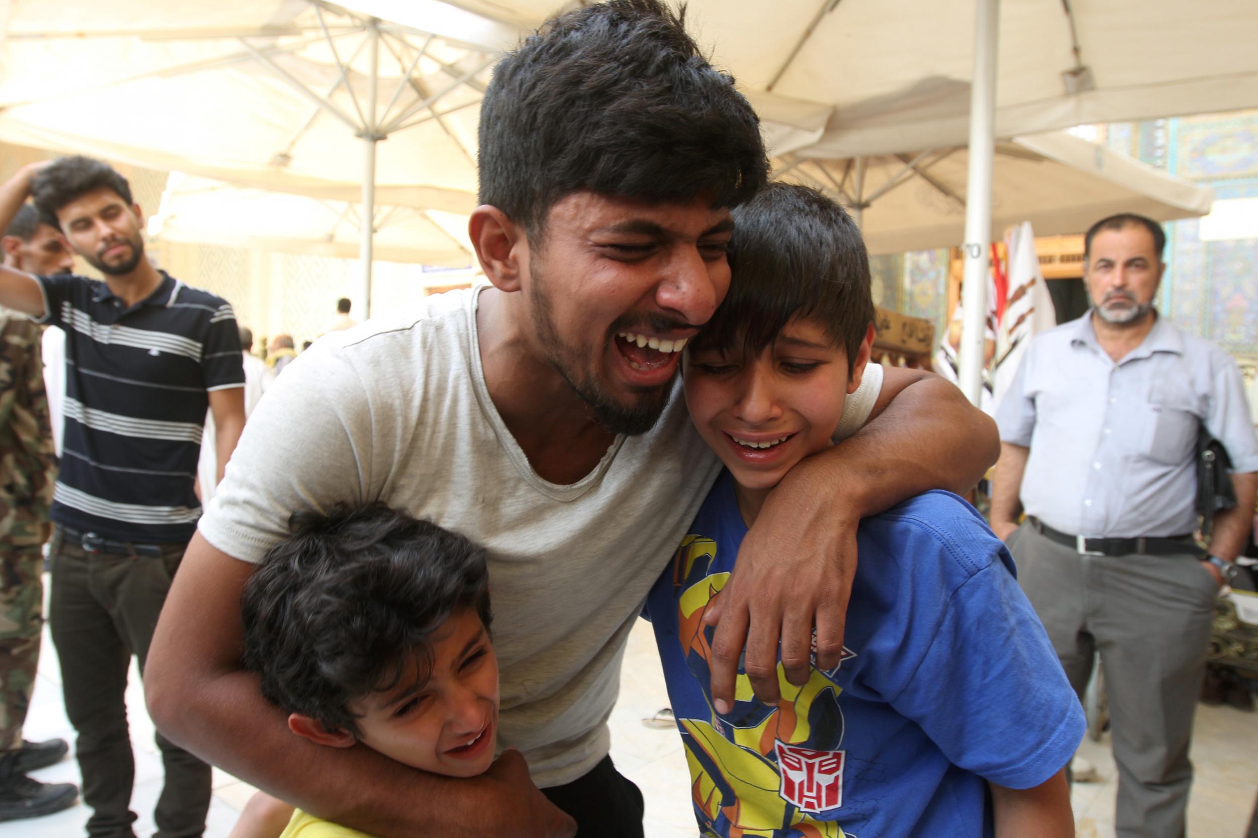 Mourners at the funeral of a victim killed in a suicide car bomb in Baghdad