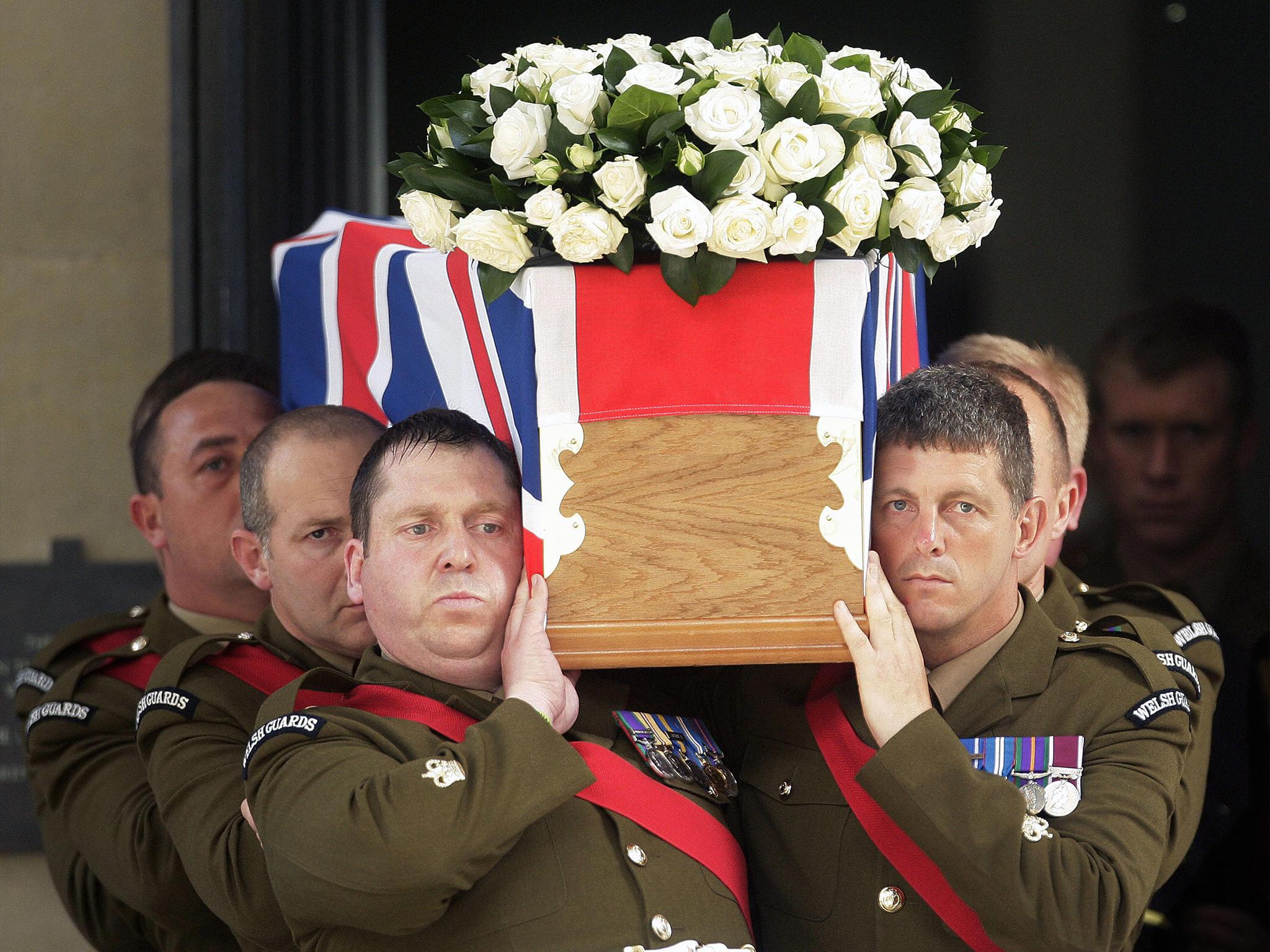 A coffin bearing the body of Britain's Lieutenant Colonel Rupert Thorneloe, of the 1st Battalion the Welsh Guards, is carried out of the Guards Chapel, in London, on July 16, 2009, after a funeral service.