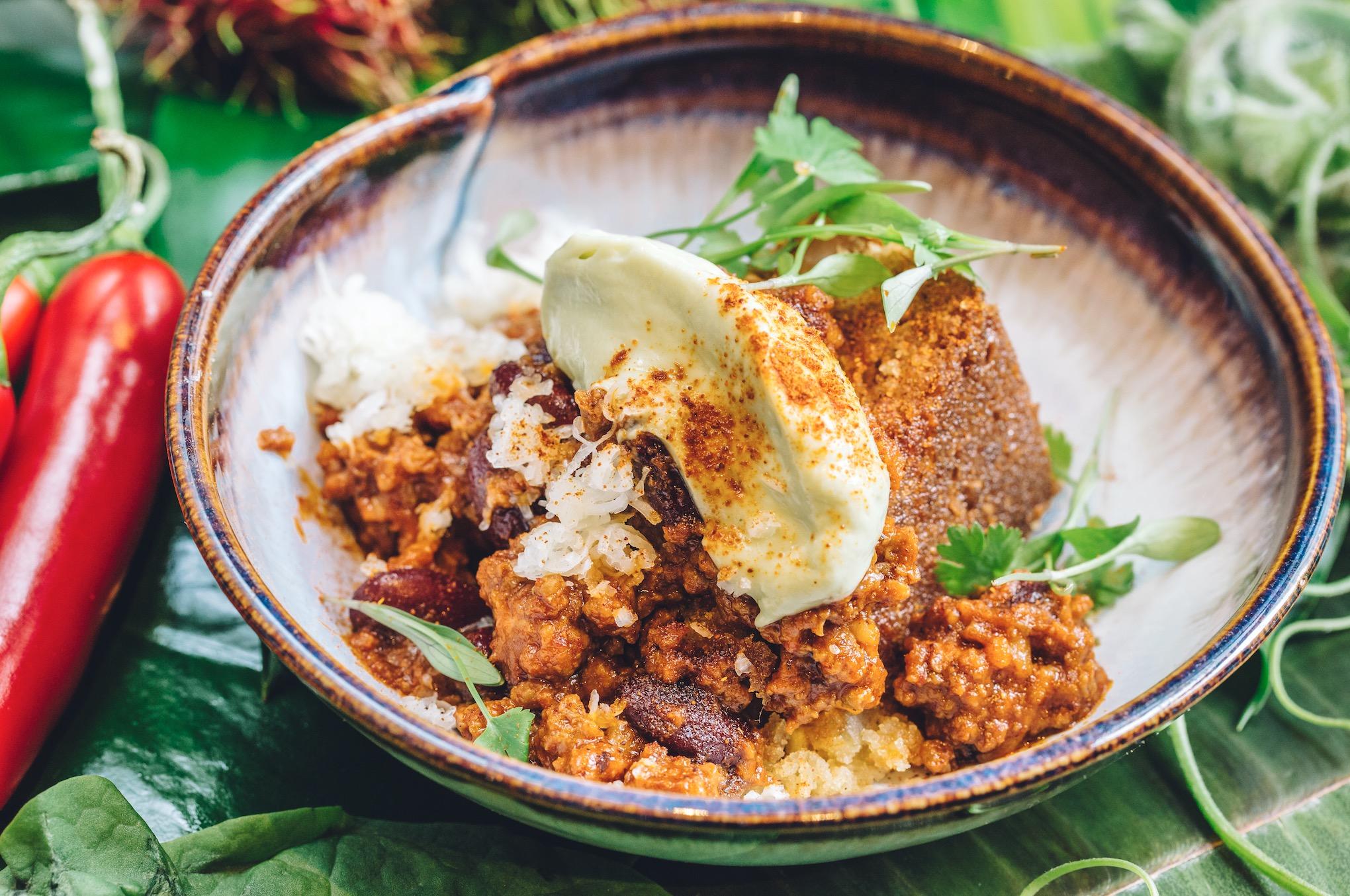 Candied ginger sweetcorn skillet cornbread, bacon chilli, avocado sour cream