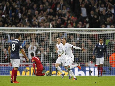 Dele Alli celebrates after opening the scoring against France at Wembley last November (Getty)