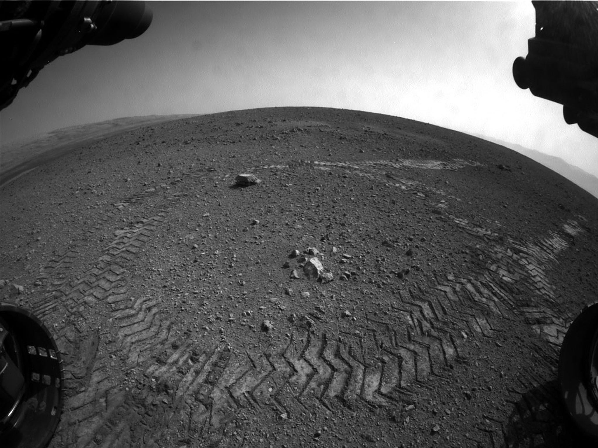 Tracks left by NASA's Curiosity rover as it completed its first test drive on Mars in August 2012