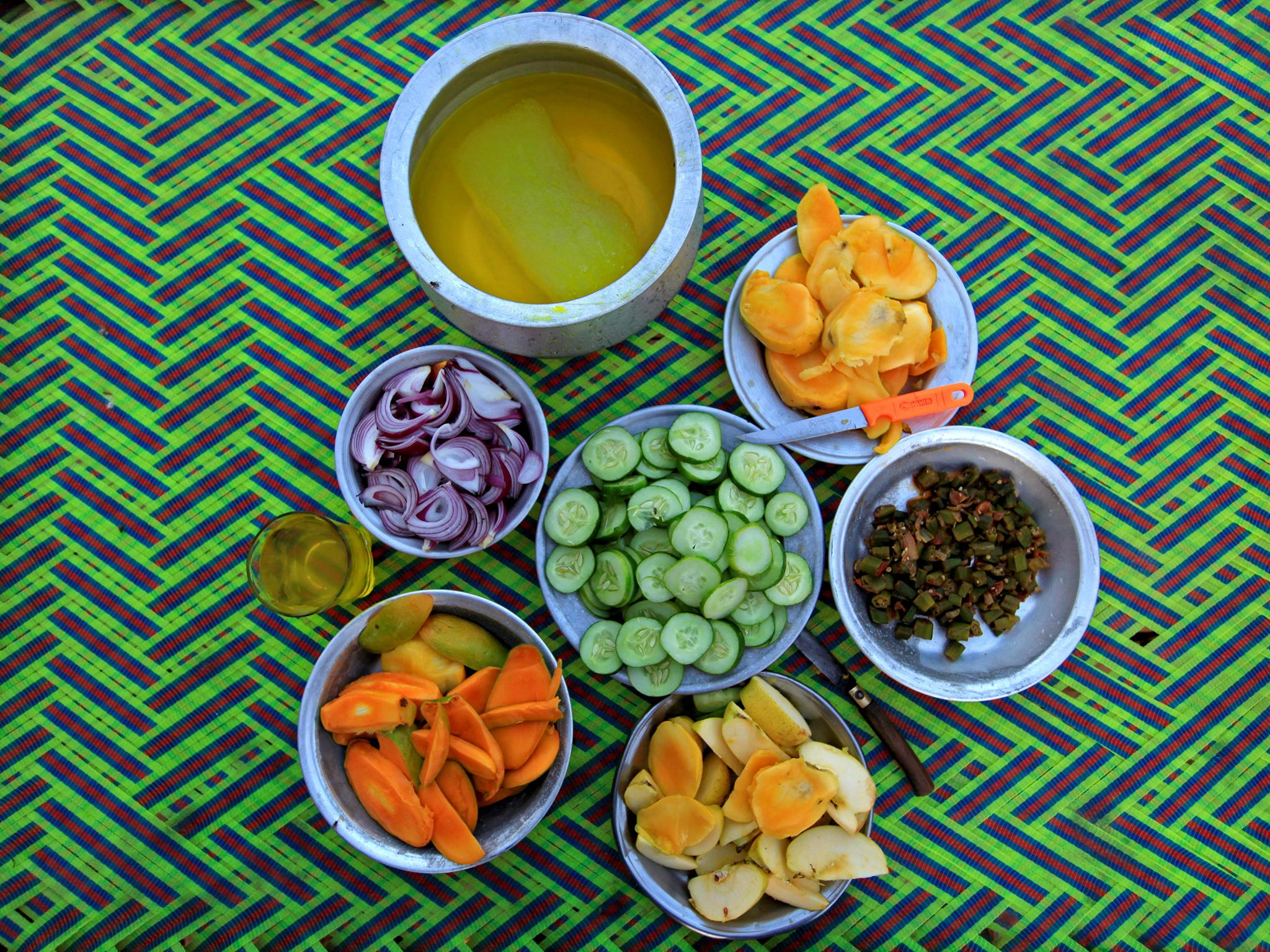 Fruits and vegetables, which workers at a brick factory shared on the outskirts of Islamabad, Pakistan