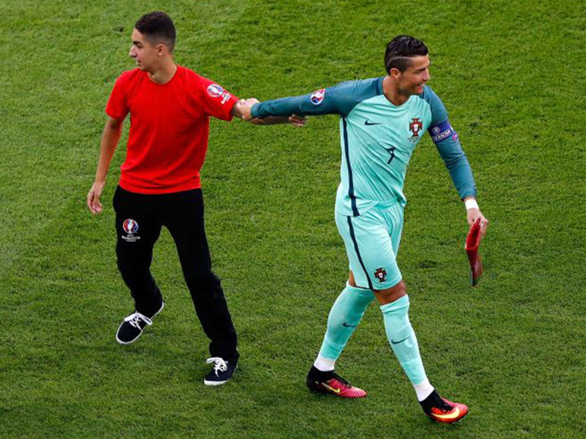 &#13;
Ronaldo found the funny side of it after the ball boy snuck into the squad photo &#13;