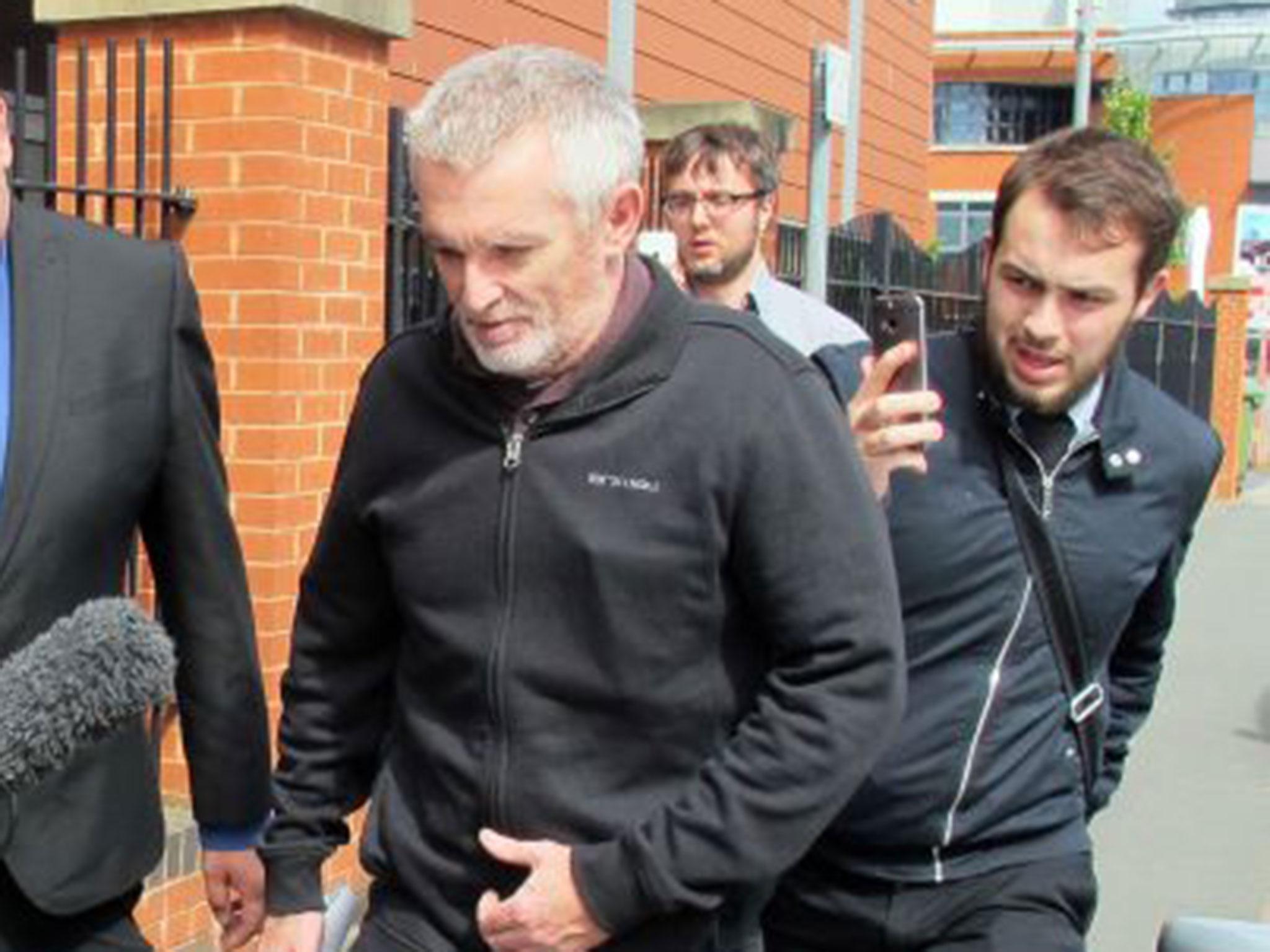 Paul Grange (centre) leaves Worcester Magistrates' Court, Worcester