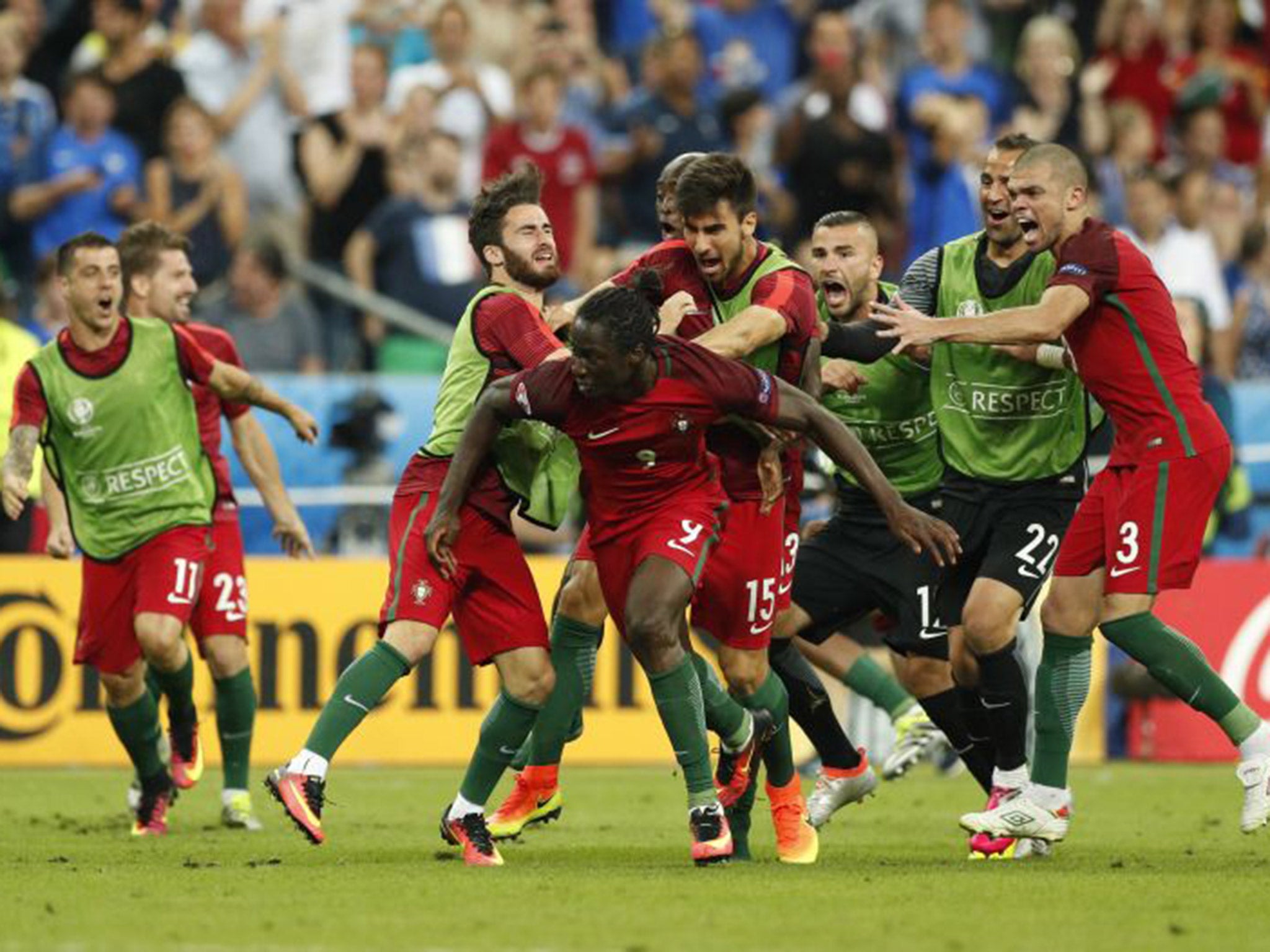 Portugal players rush to celebrate with Eder after he scores in the Euro 2016 final