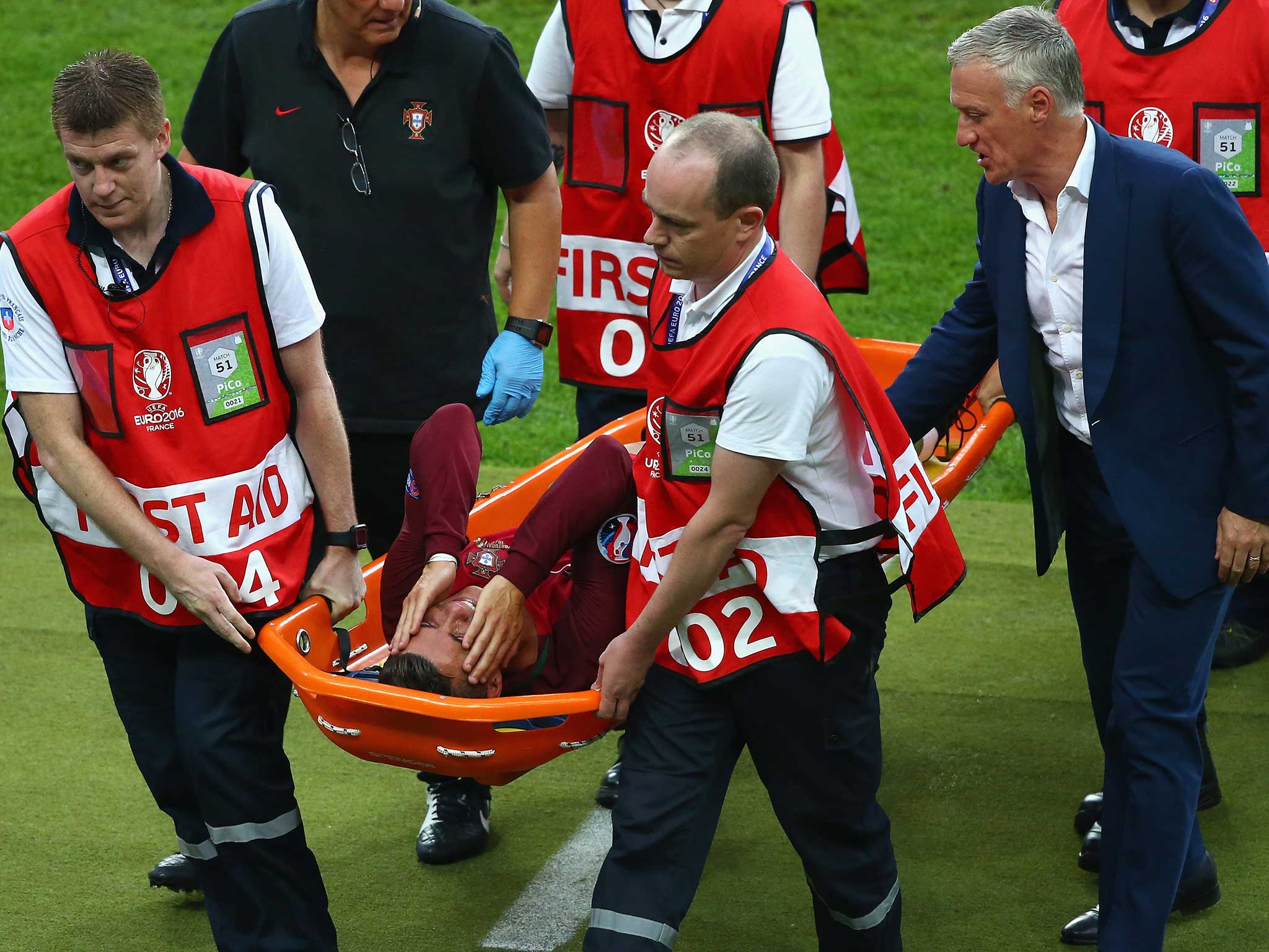 The Portuguese forward is stretchered off the Stade de France pitch