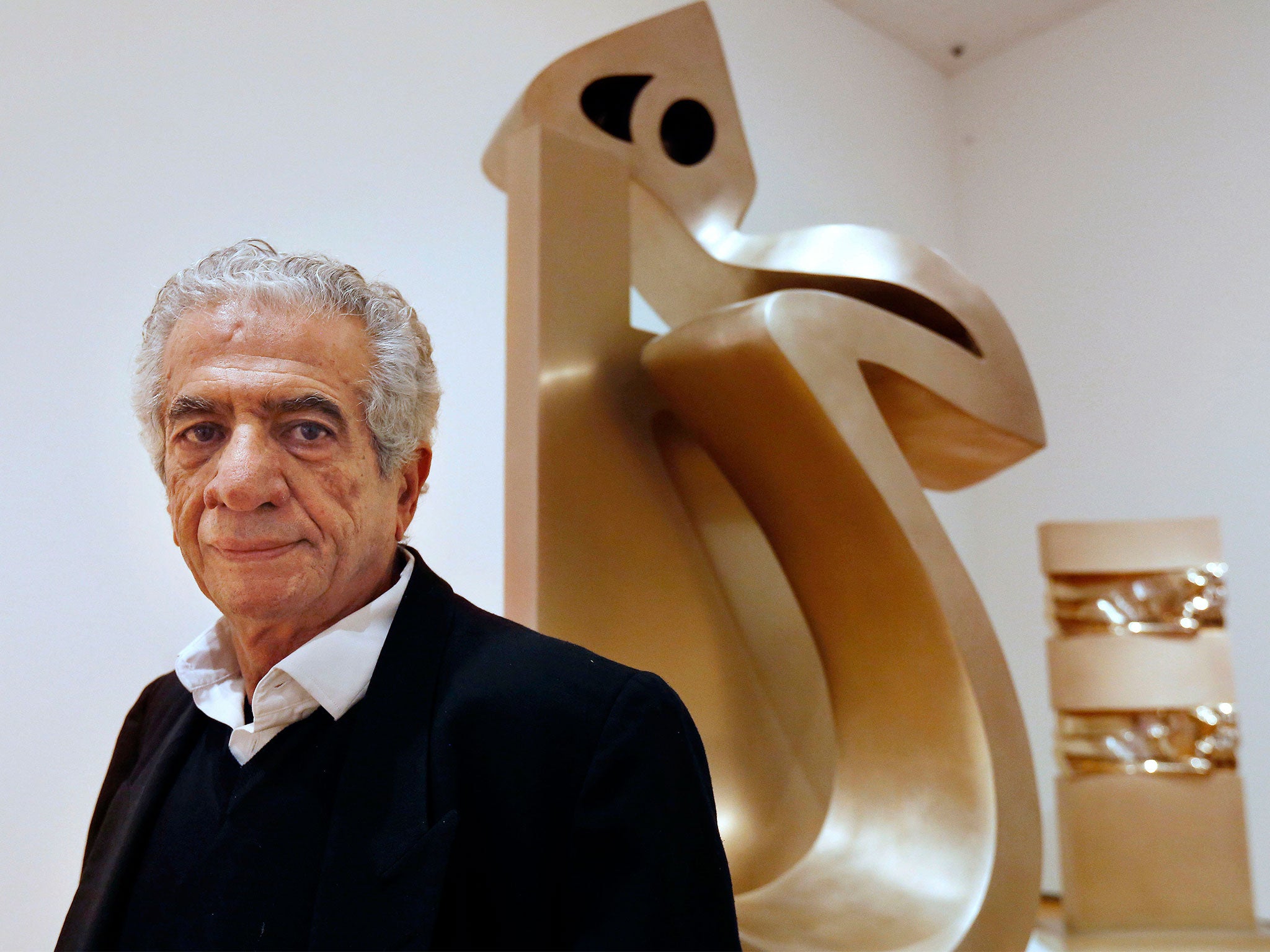 Parviz Tanavoli stands near one of his sculptures called "Heech on Chair" at the Davis Museum on the campus of Wellesley College, US