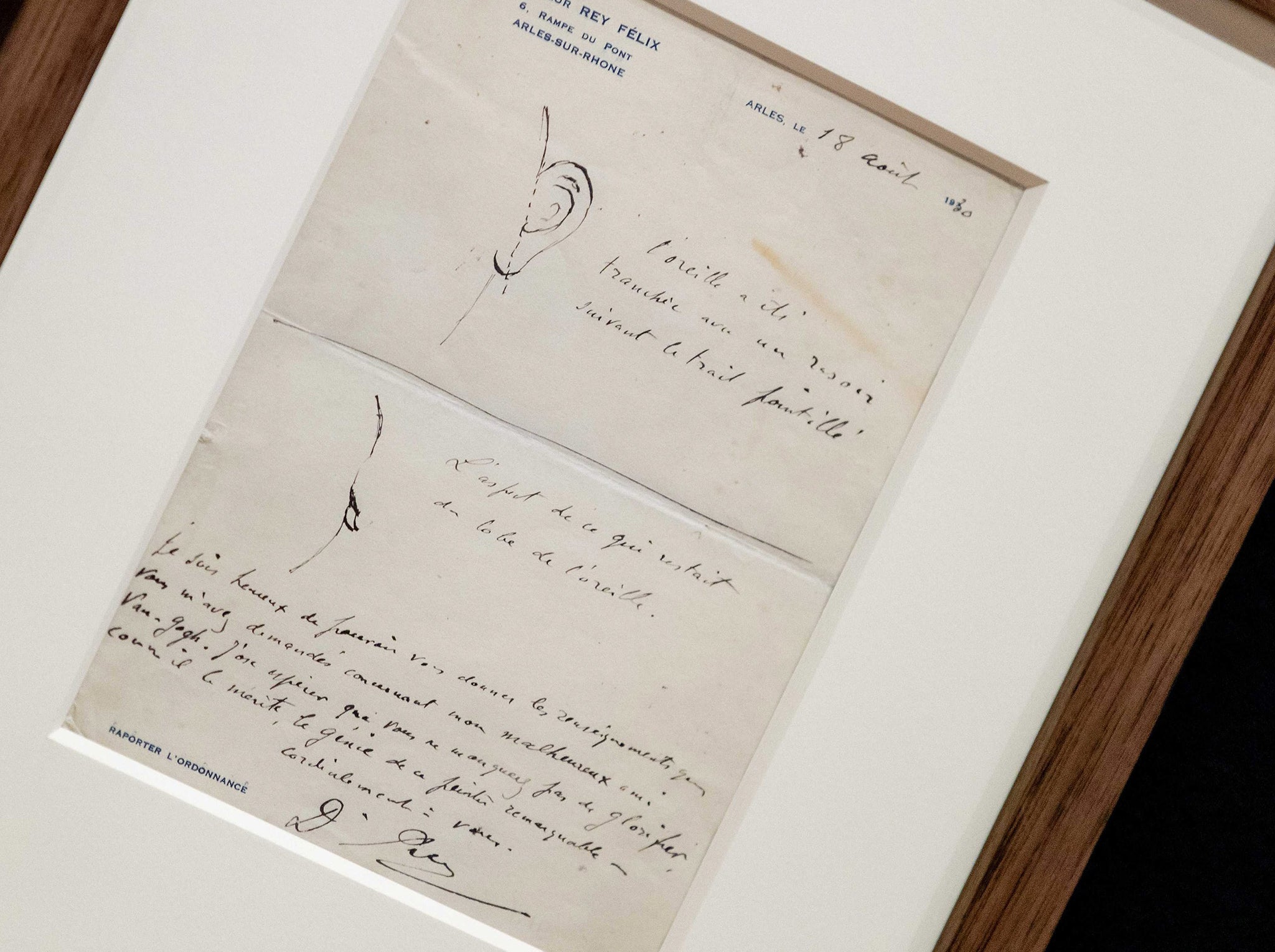 A close-up view of the letter by Dr. Felix Rey about the ear of Vincent van Gogh is displayed as part of the exhibition 'On the Verge of Insanity.