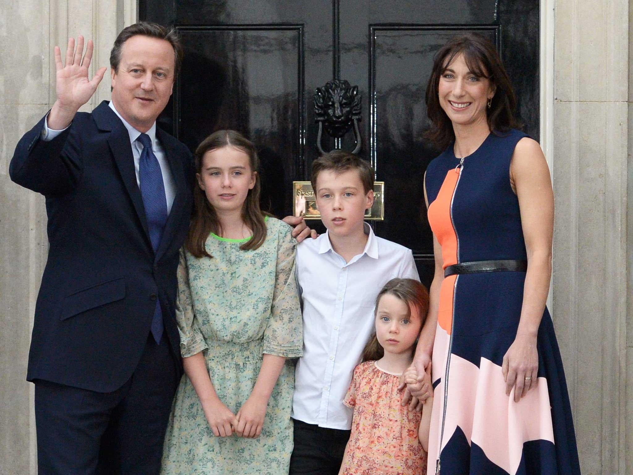 David Cameron waves outside No 10 with his family as he leaves for the final time