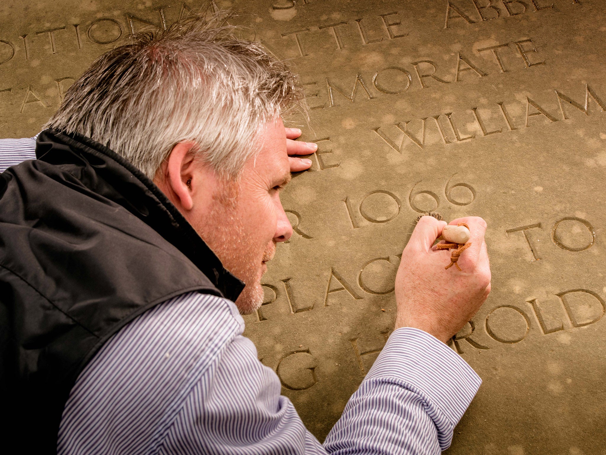 Roy Porter puts the finishing touches to the stone marking the traditional spot where King Harold fell