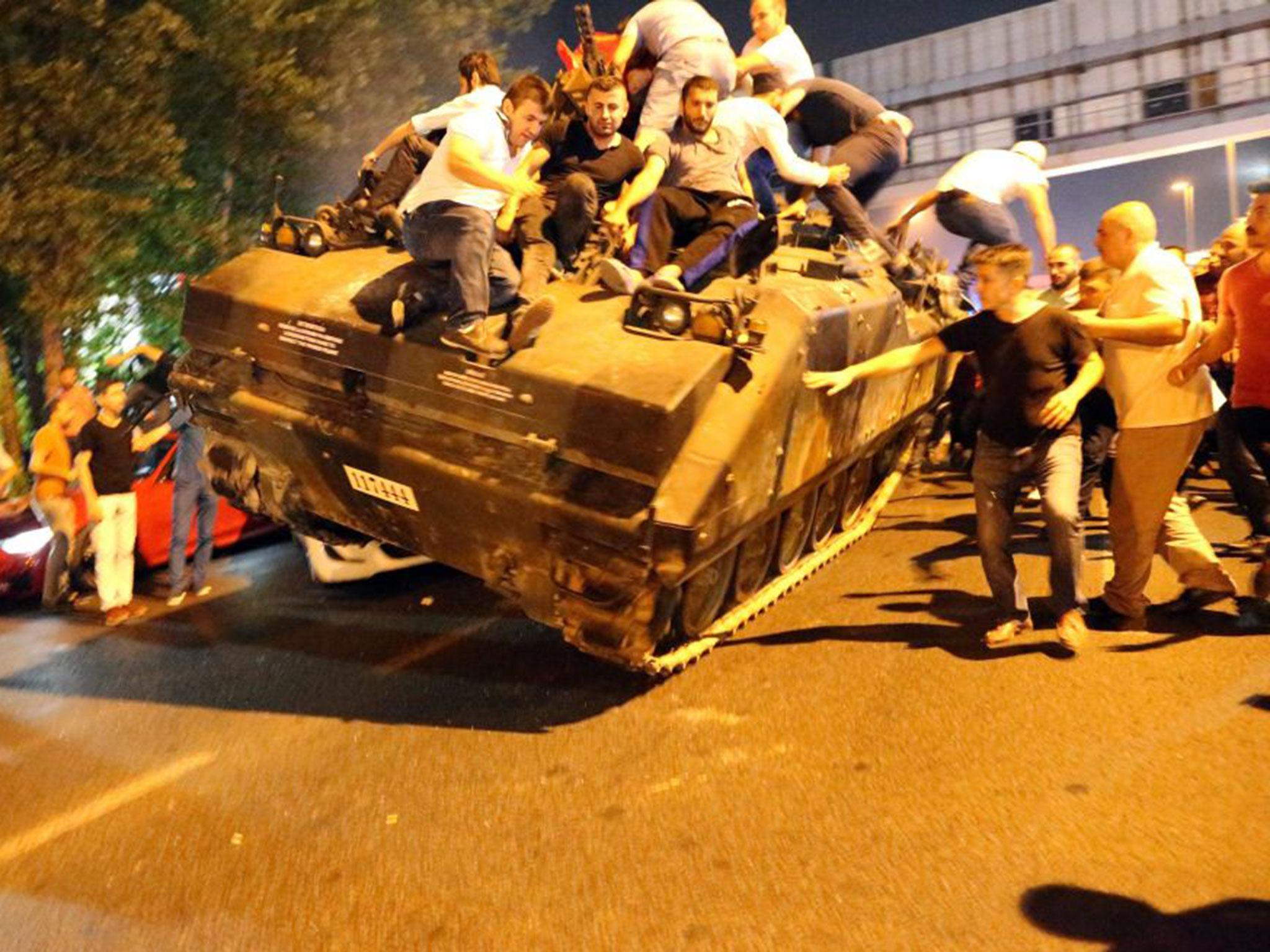 Erdogan supporters on tank in Istanbul