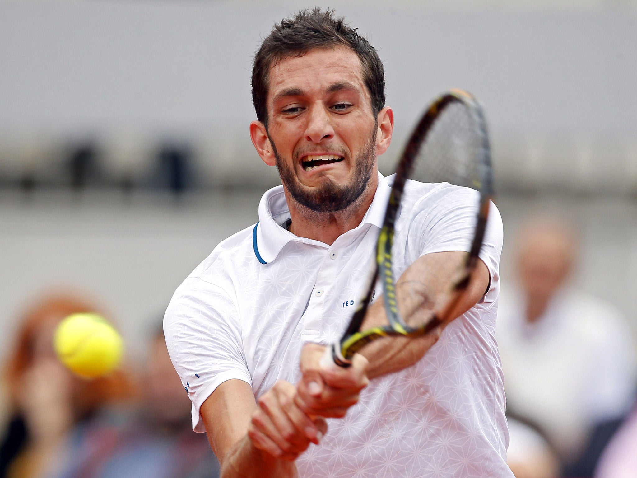 James Ward suffered a straight-sets defeat in his Davis Cup quarter-final clash with Dusan Lajovic