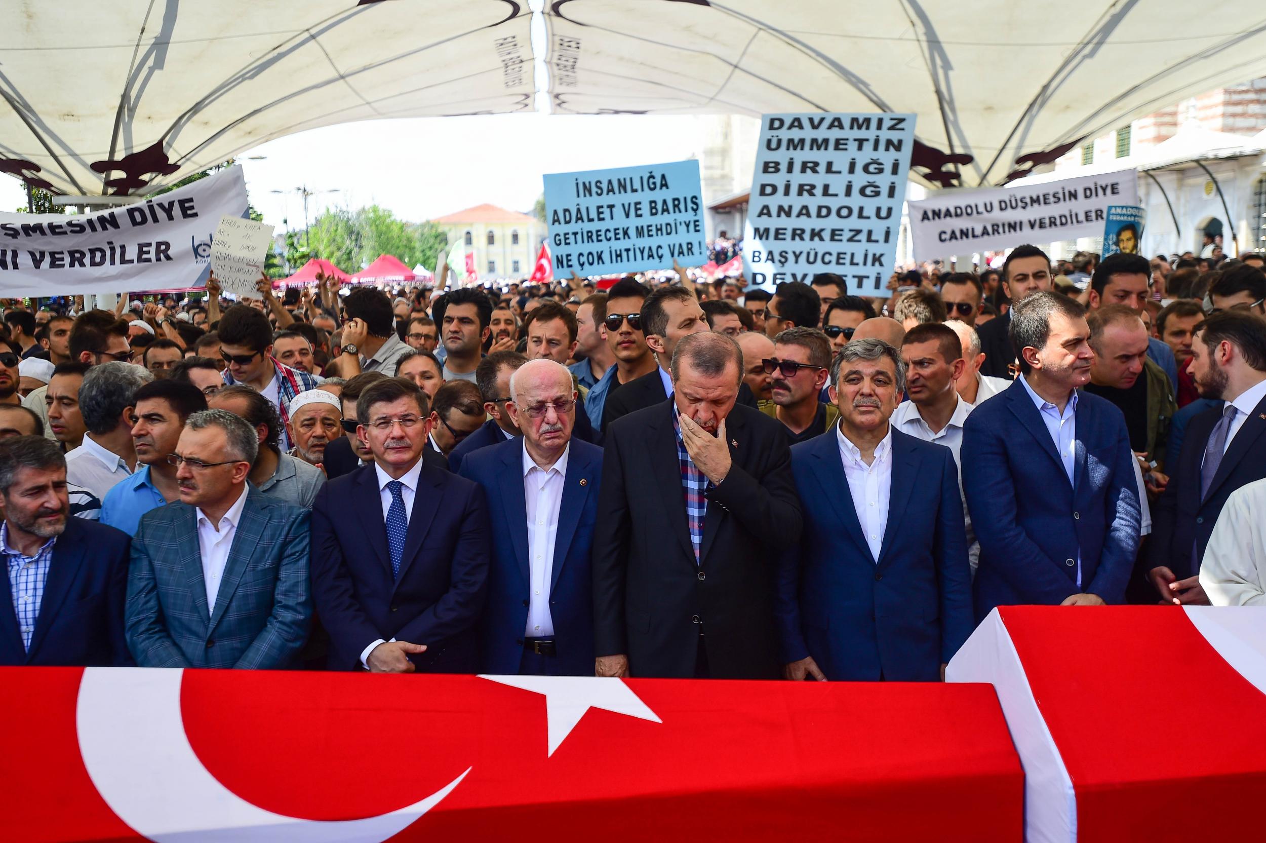 President Erdogan at a funeral for one of those killed during the clashes (Getty)