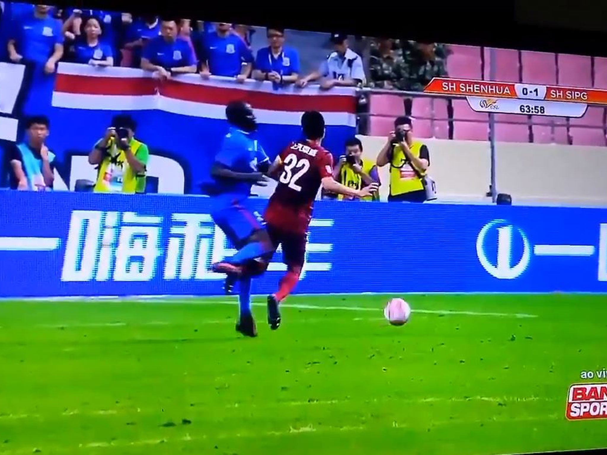 Demba Ba clashes with a SIPG defender in a relatively innocuous challenge