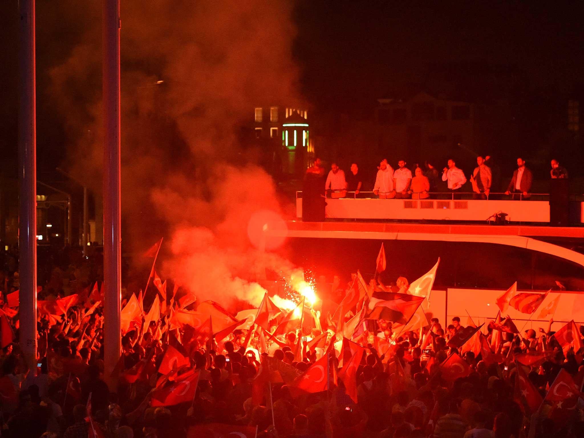 People participate in a rally in support of Turkish President Recep Tayyip Erdogan at Taksim square in Istanbul