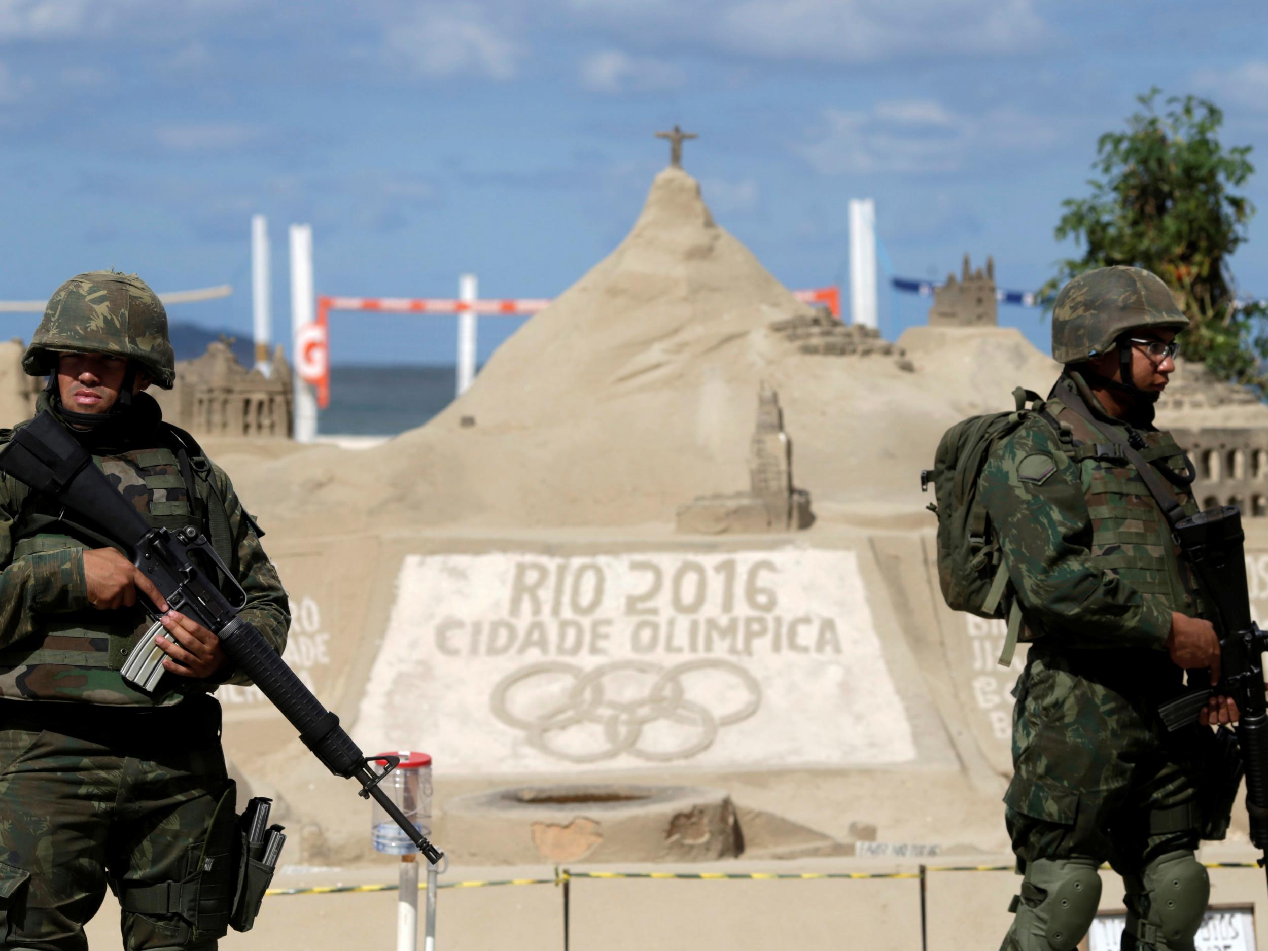 Brazilian Army Forces soldiers patrol on Copacabana beach ahead of the 2016 Rio Olympic games in Rio de Janeiro, Brazil, July 18, 2016