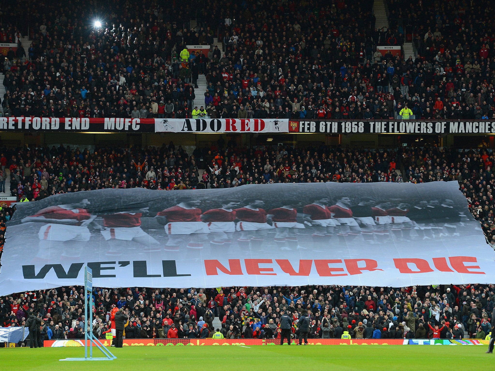 A banner paying tribute to the 'Busby Babes' is displayed in the Stretford End at Old Trafford