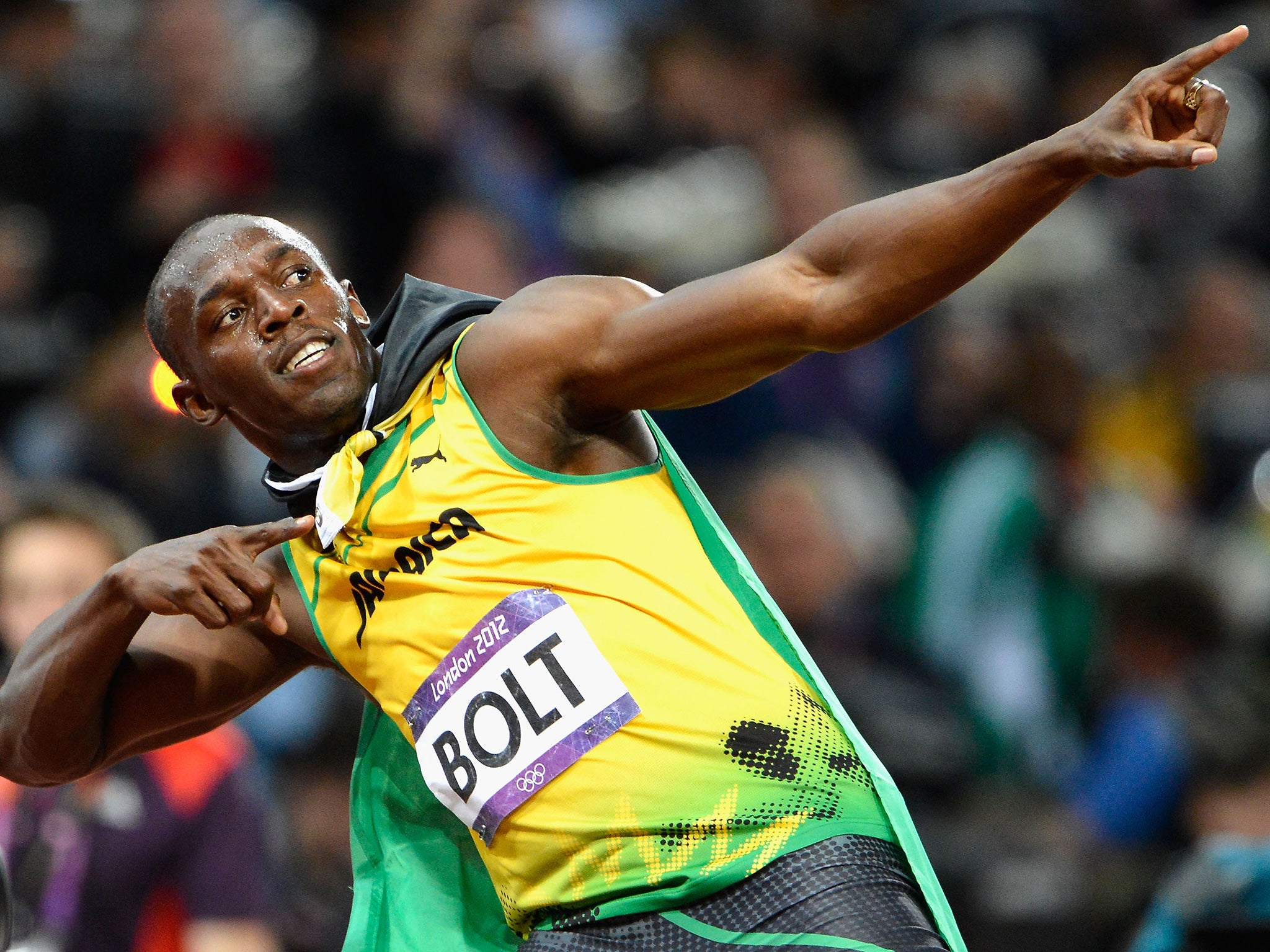 Bolt celebrates his victory in the 100m final at London 2012