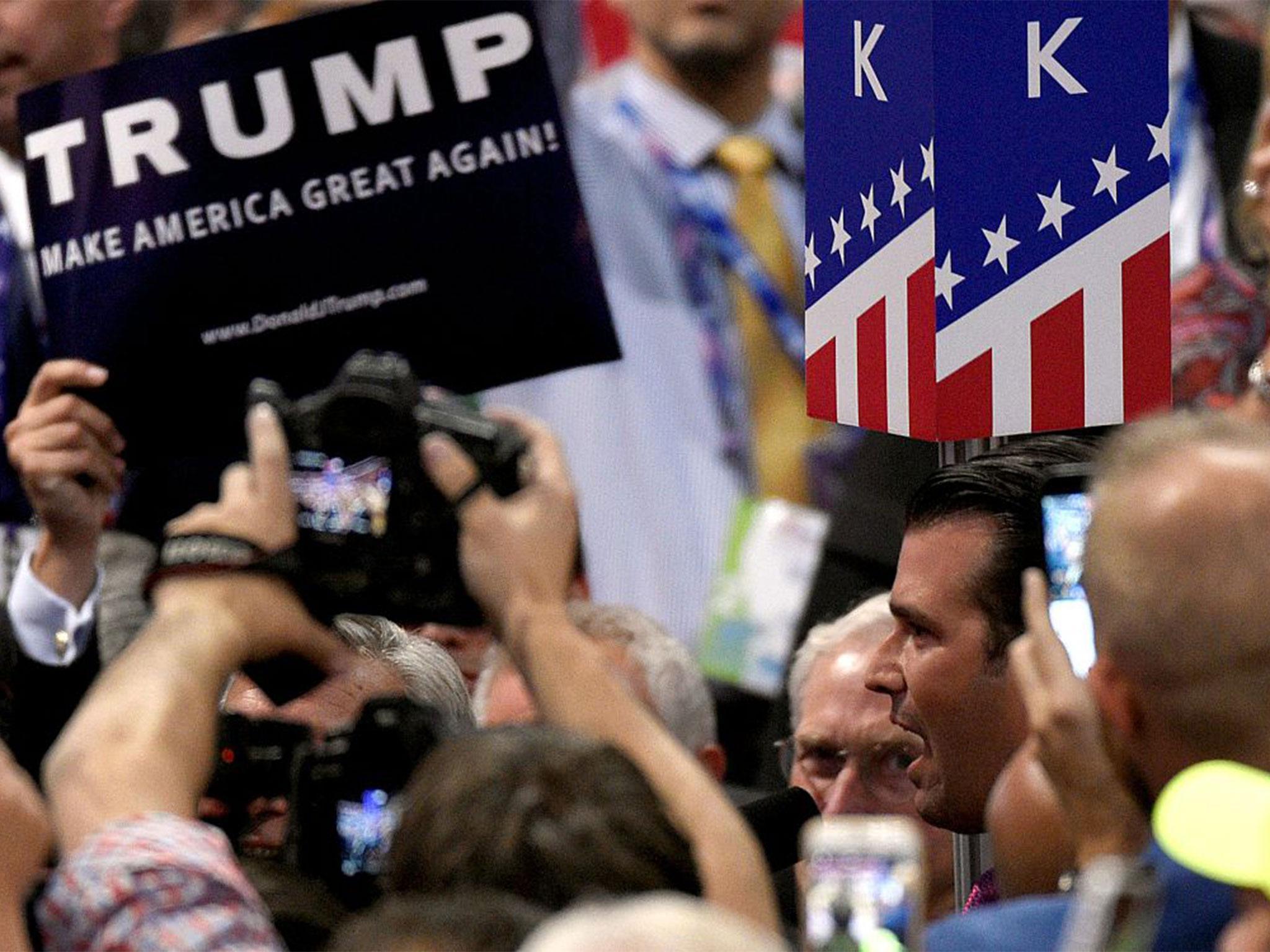 Donald Trump Jr. announces the New York delegation's votes during roll call at the Republican Convention