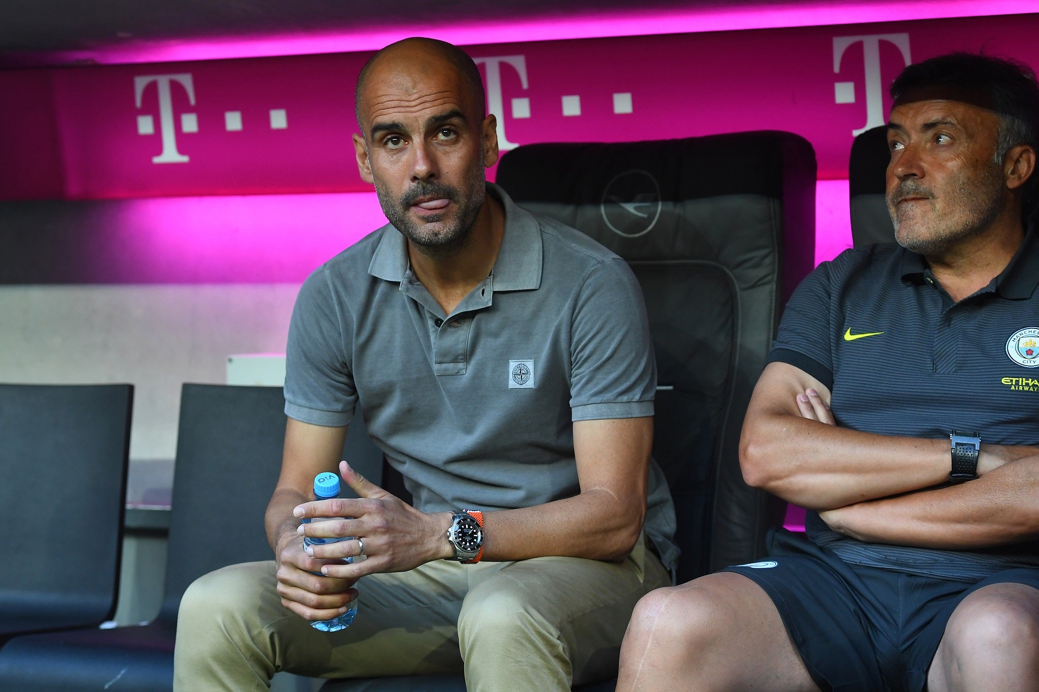 Pep Guardiola watches on from the Manchester City dugout