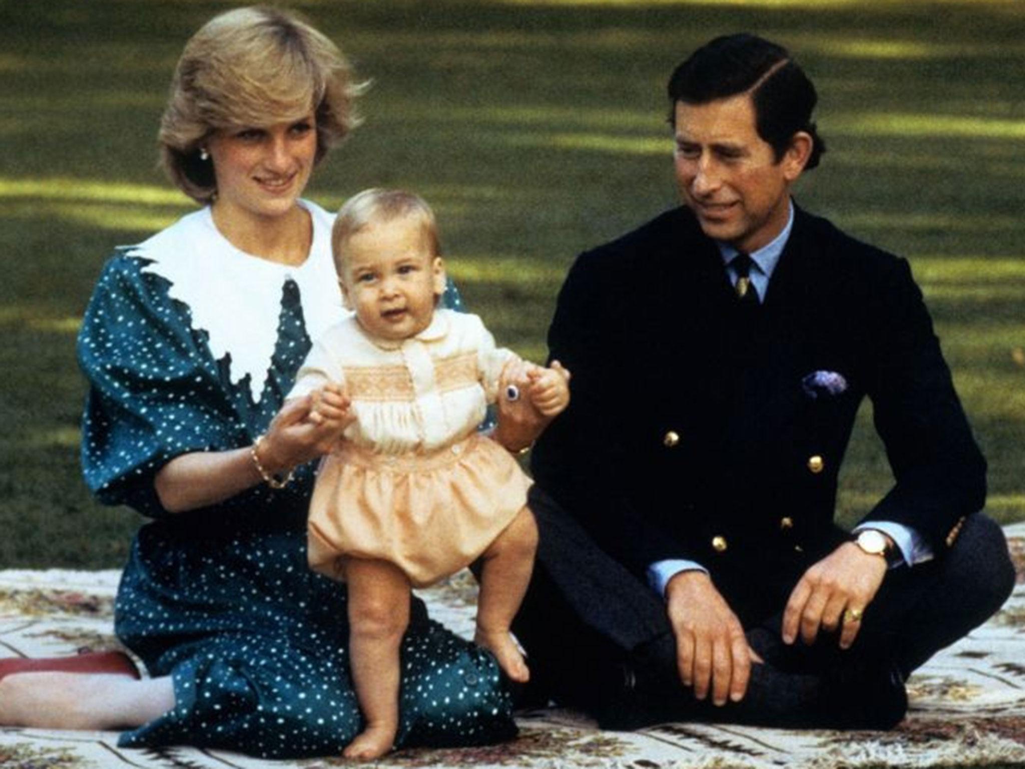 File photo dated 01/05/83 of the Prince and Princess of Wales and Prince William on a rug in the grounds of Government House in Auckland, New Zealand