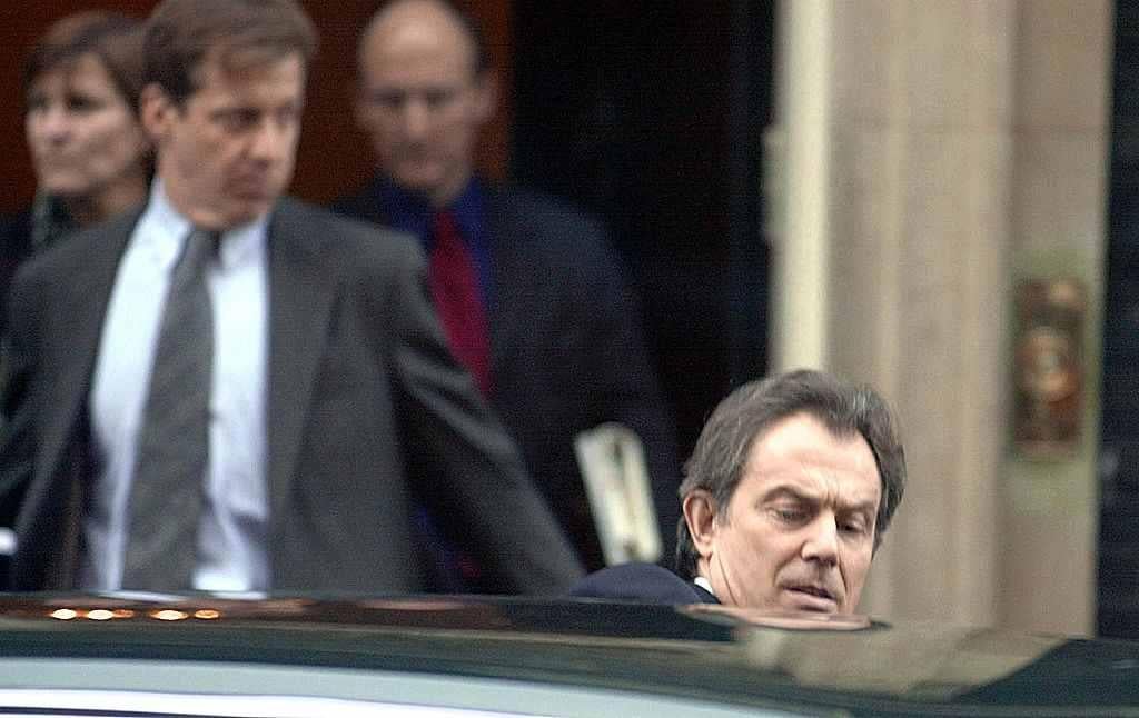 Alastair Campbell, in the background to the left, was a key force behind Blair. Photo: Getty.