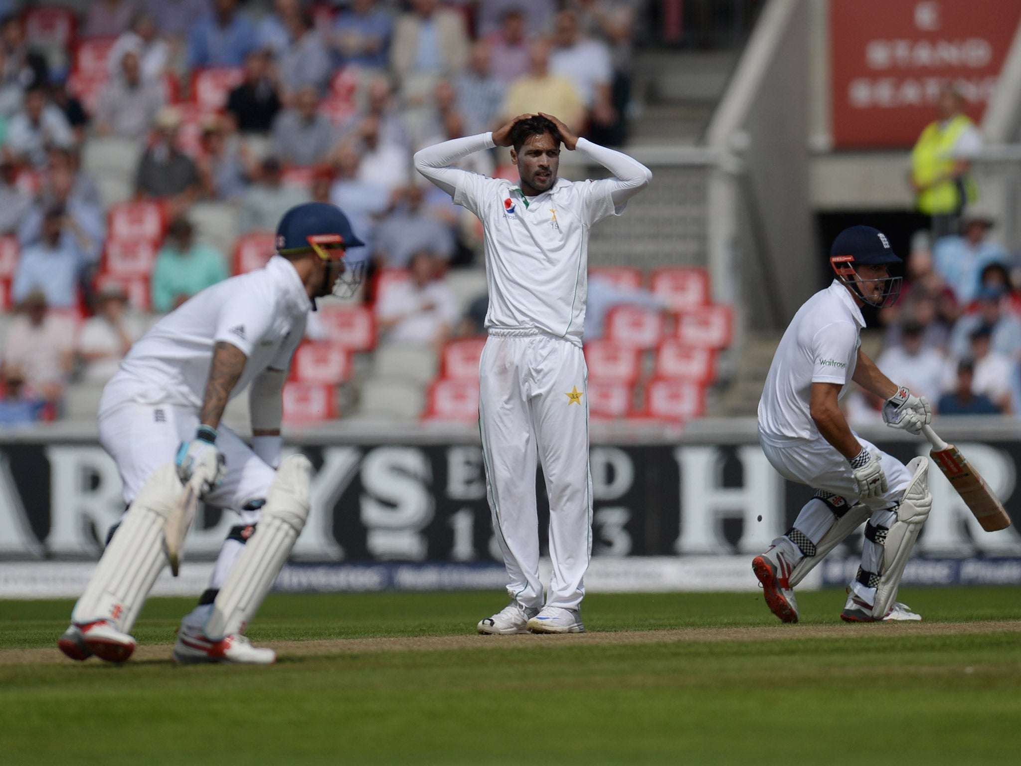 Mohammad Amir reacts after a close call during the first innings