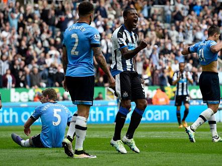 Georginio Wijnaldum celebrates a goal for Newcastle in May but was unable to prevent their relegation (Getty)