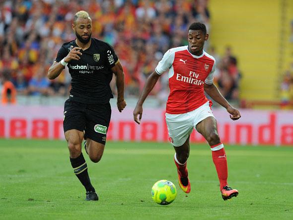 Jeff Reine-Adelaide takes on Lens midfielder John Bostock (Getty)