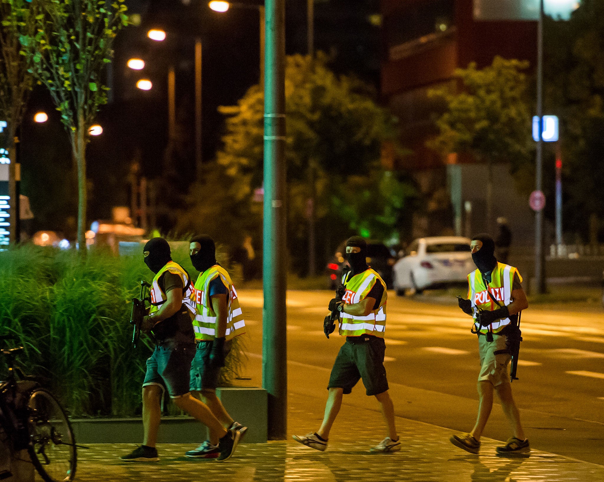 Police officers secure the area around the Olympia Einkaufzentrum