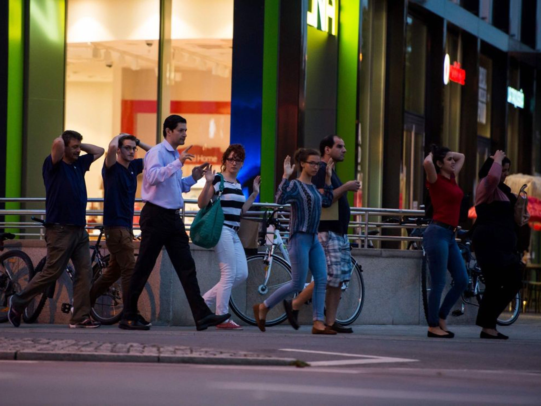 Shoppers are evacuated from the mall yesterday where the attack happened