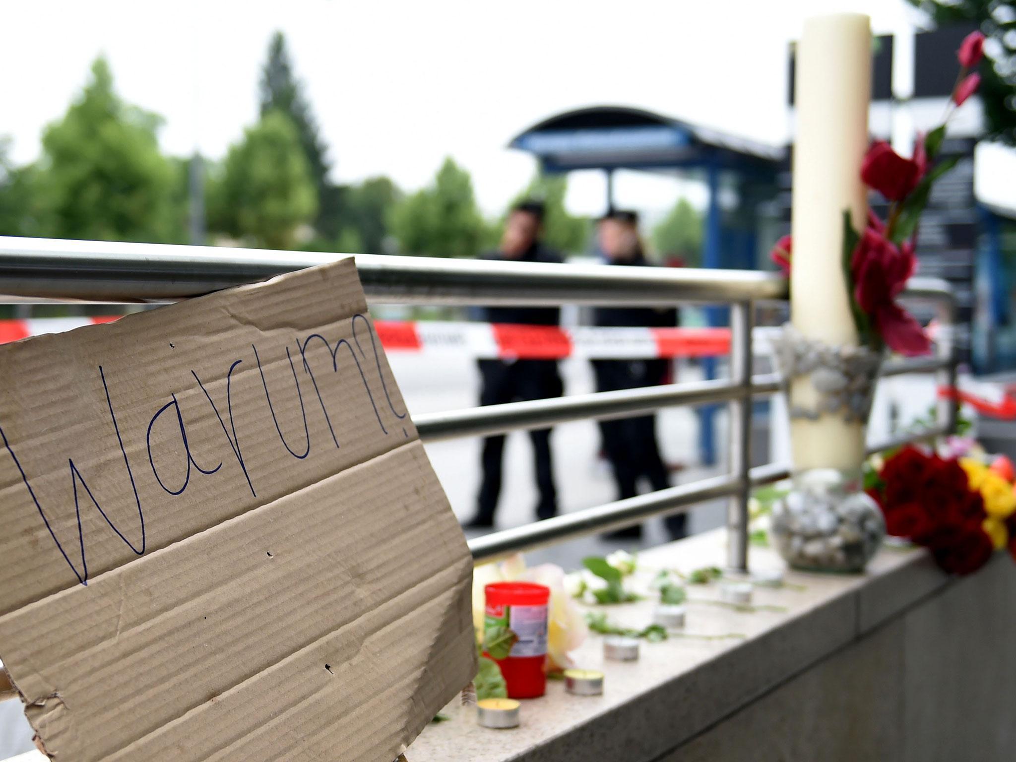 'Why?' - Flowers lie near the scene of the shooting