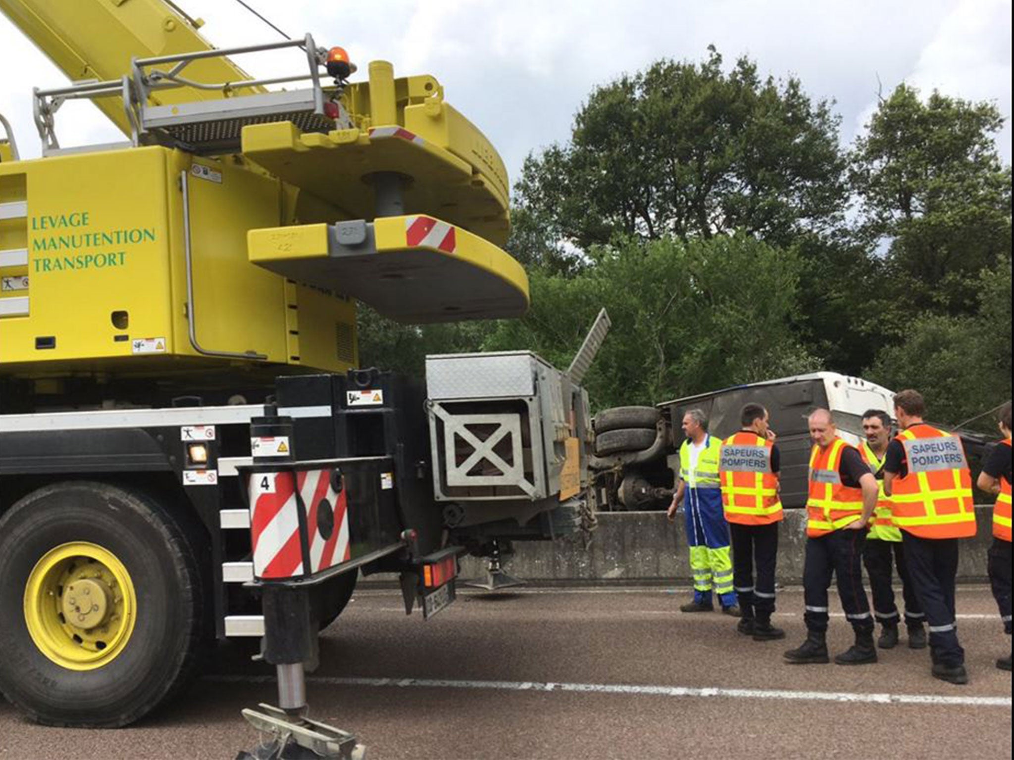 More than a dozen teenagers were injured after the bus crashed onto its side on a stretch of motorway near the Swiss border.