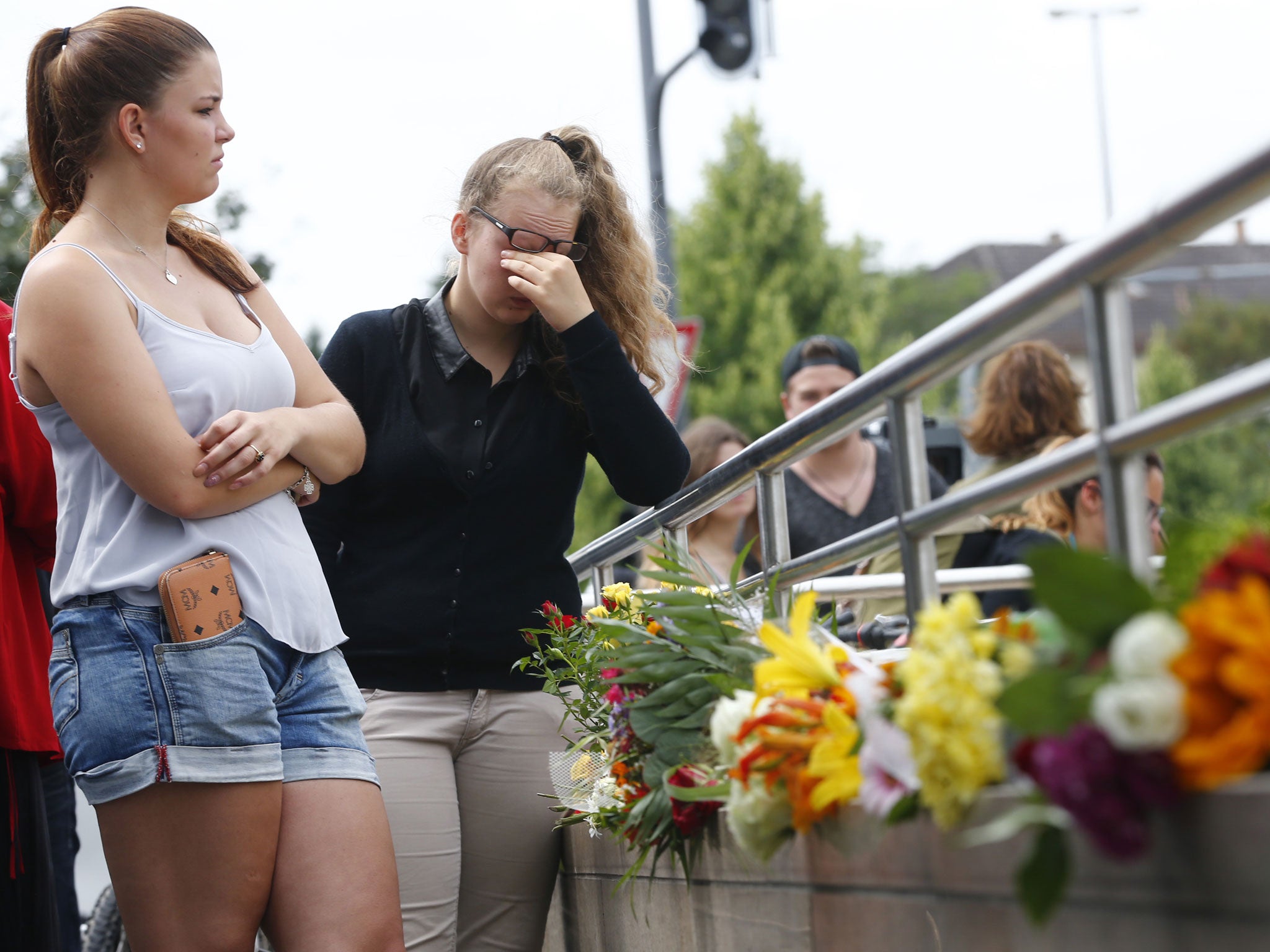 People gather in Munich to pay tribute to the victims