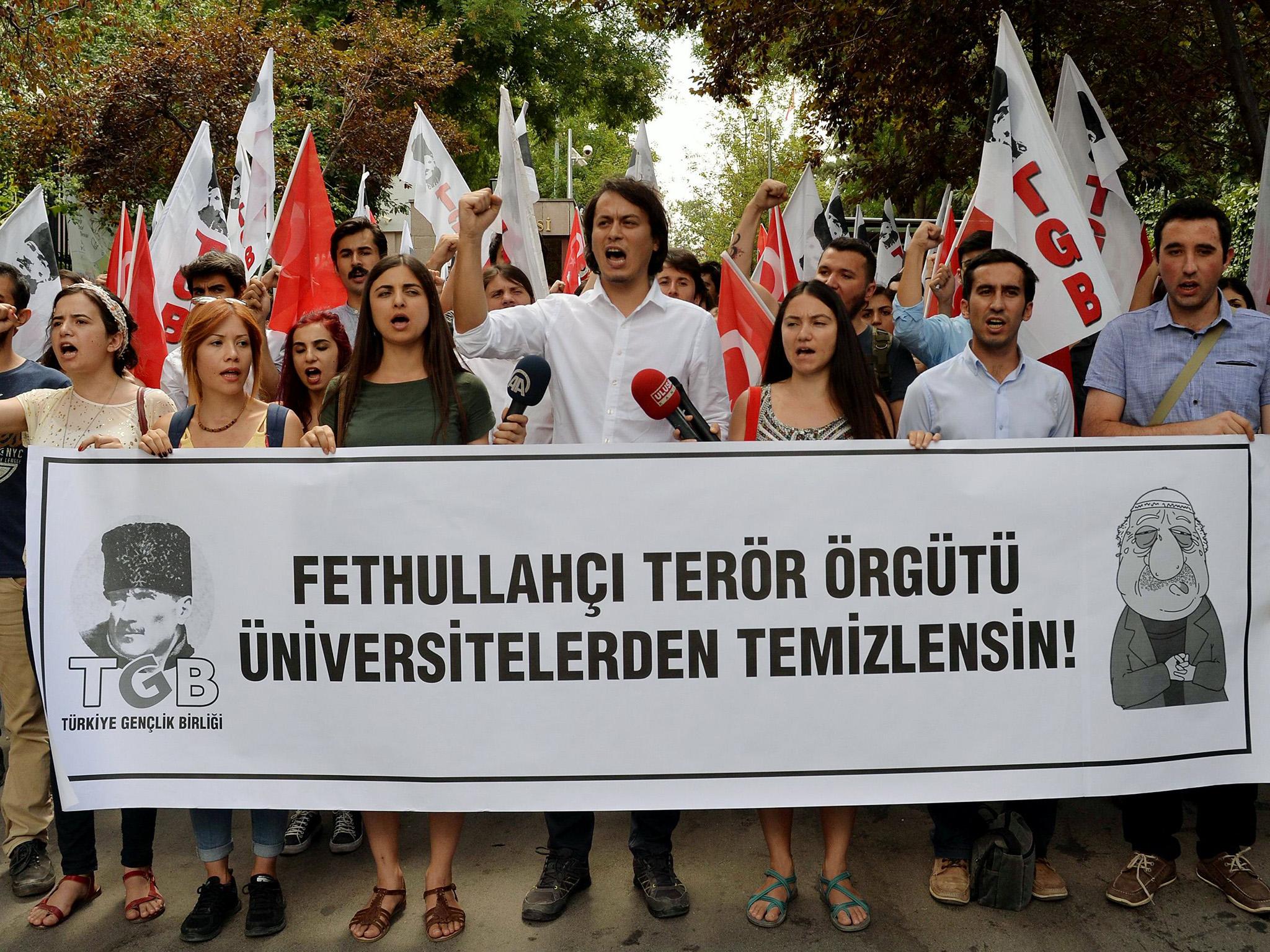 Pro-nationalist university students hold a protest against US-based cleric Fethullah Gulen and his followers during a demonstration in Ankara after last year’s abortive coup