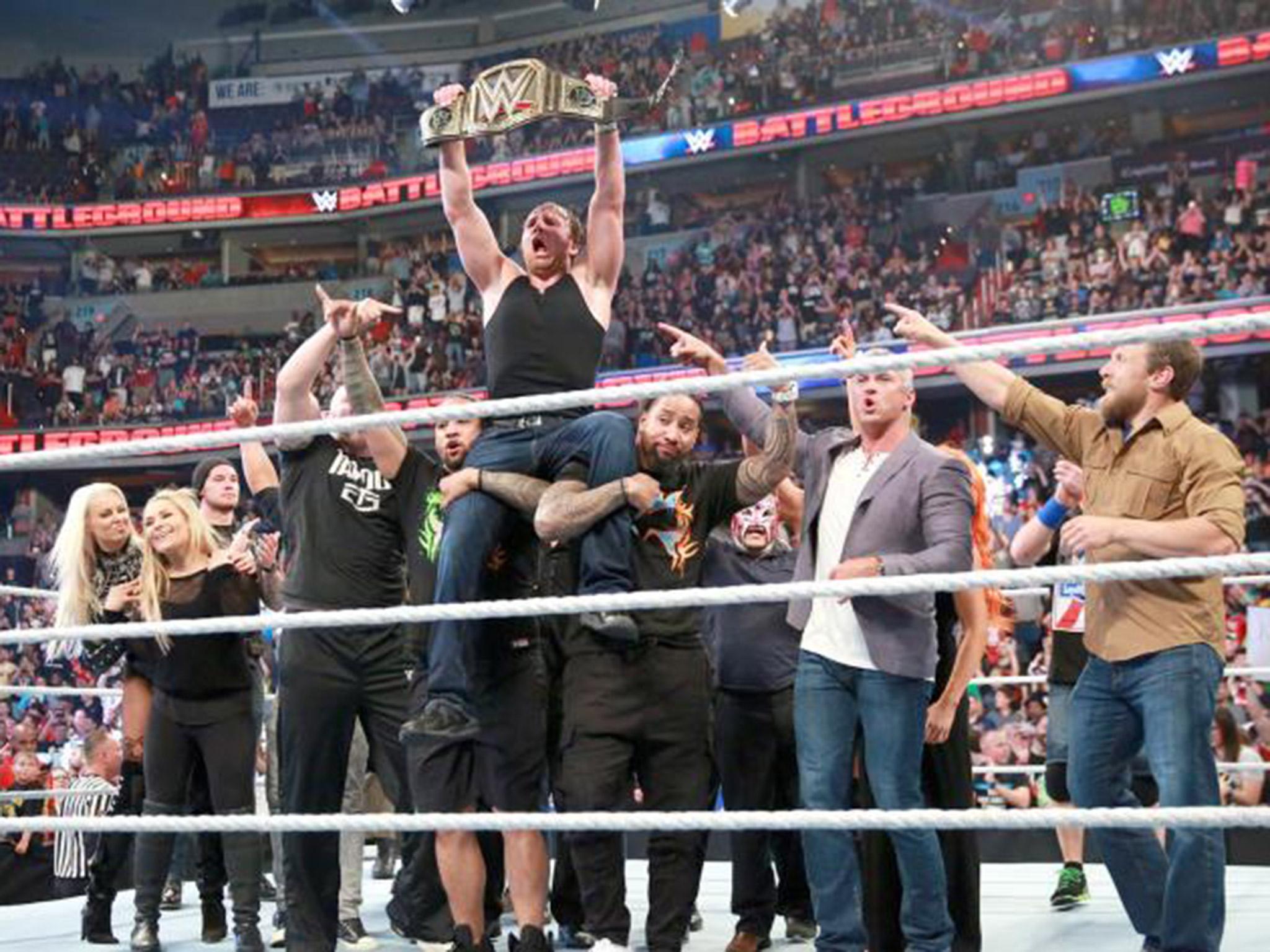 Dean Ambrose celebrates with the rest of the Smackdown roster (WWE.com)