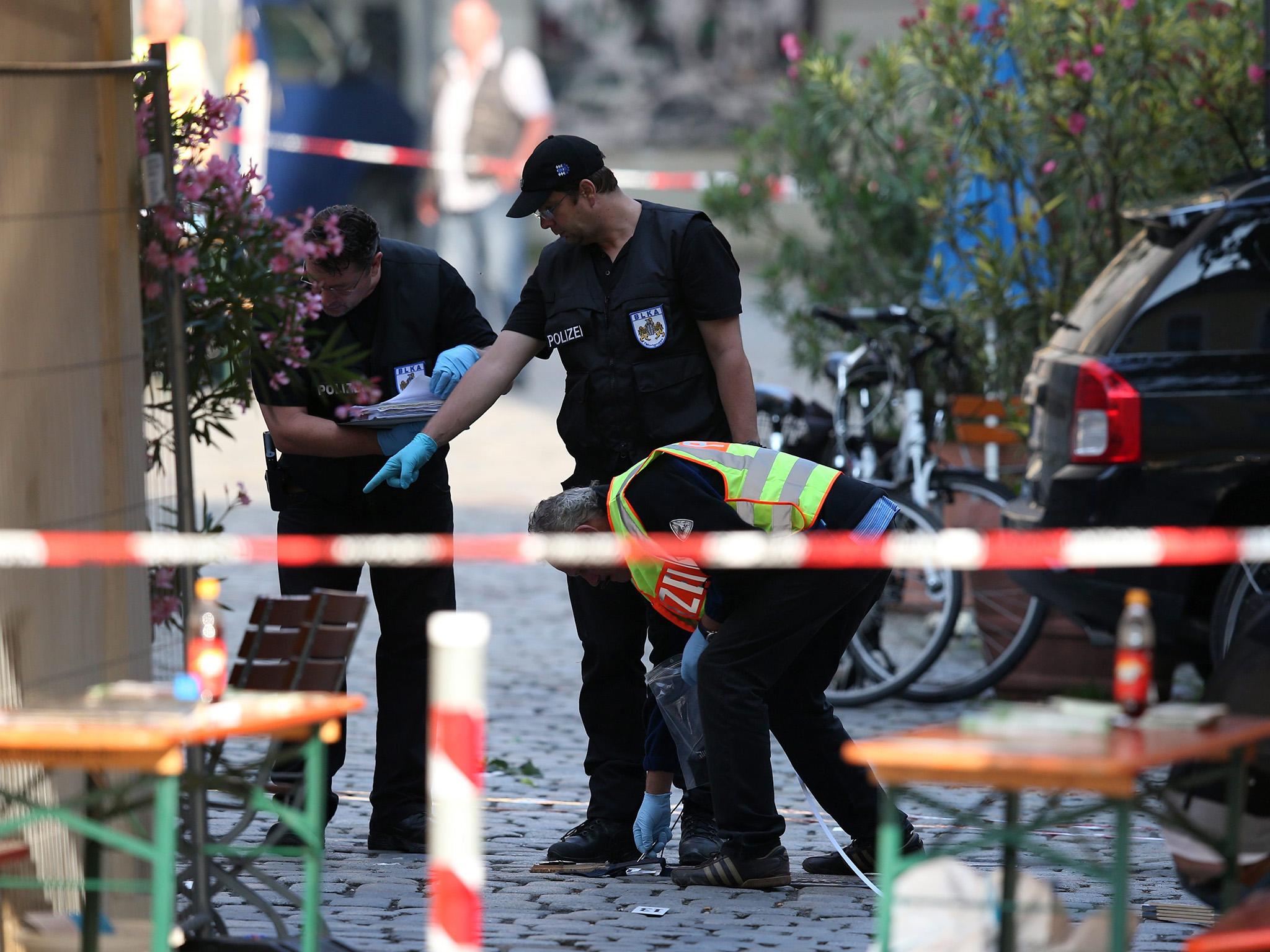 Police officers operate on a scene following an explosion in Germany