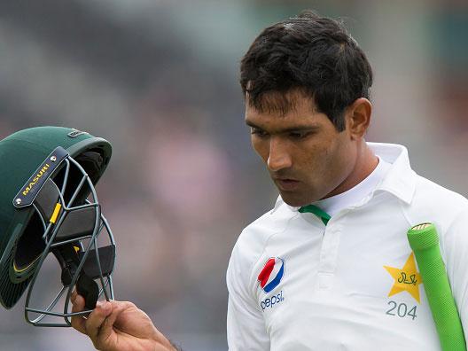 Asad Shafiq trudges from the field after losing his wicket in Manchester on Monday (Getty)