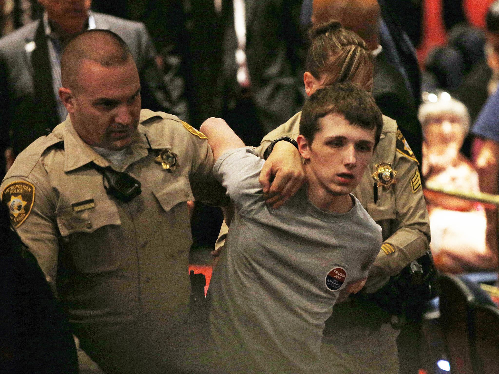 Police remove Michael Sandford from the Treasure Island Casino in Las Vegas after the incident