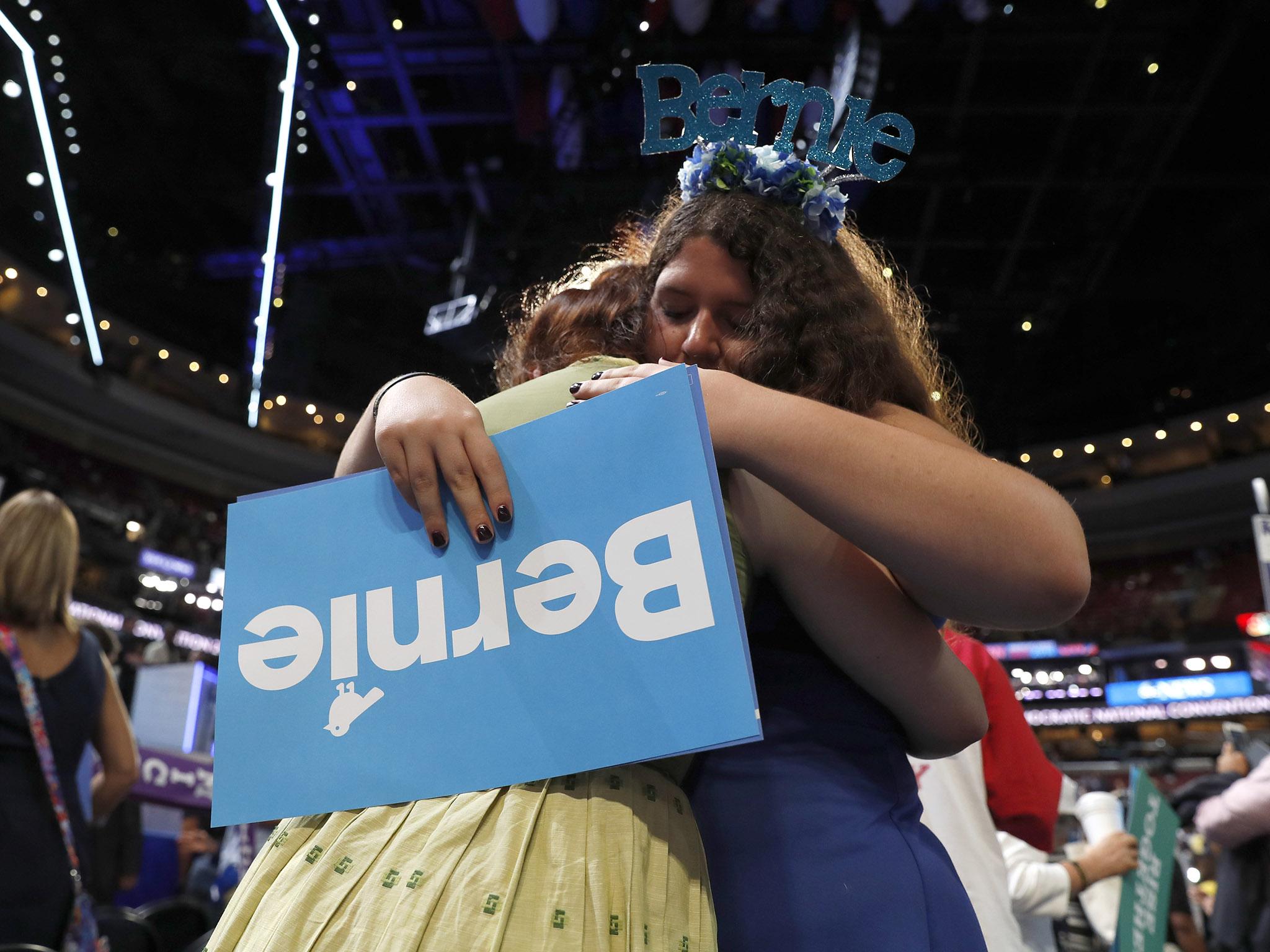 Delegates Amanda McIllmurray and Katherine Sayder cry following Sanders address