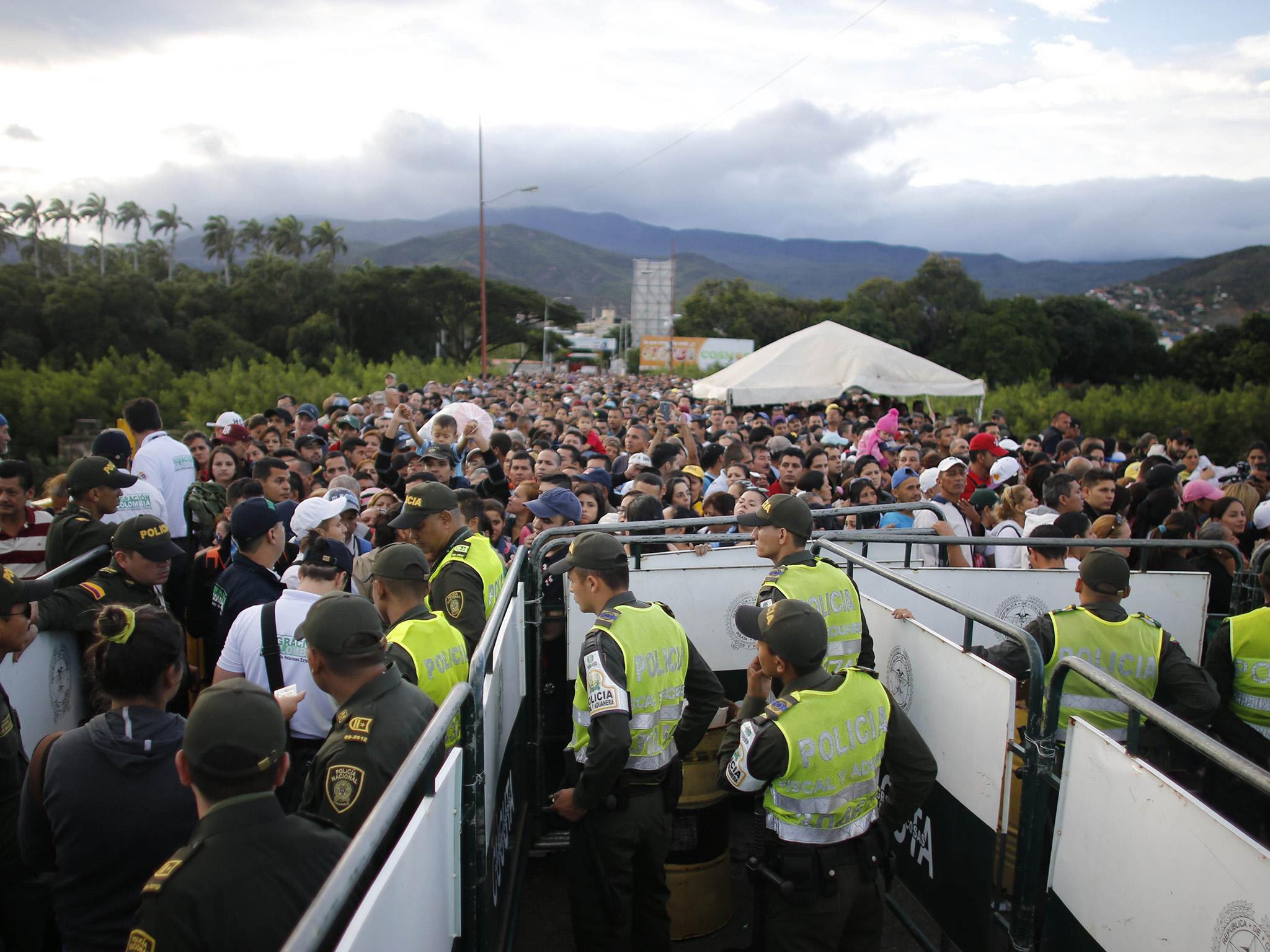 Venezuelans cross the Simon Bolivar bridge that links San Antonio del Tachira, Venezuela, with Cucuta, Colombia