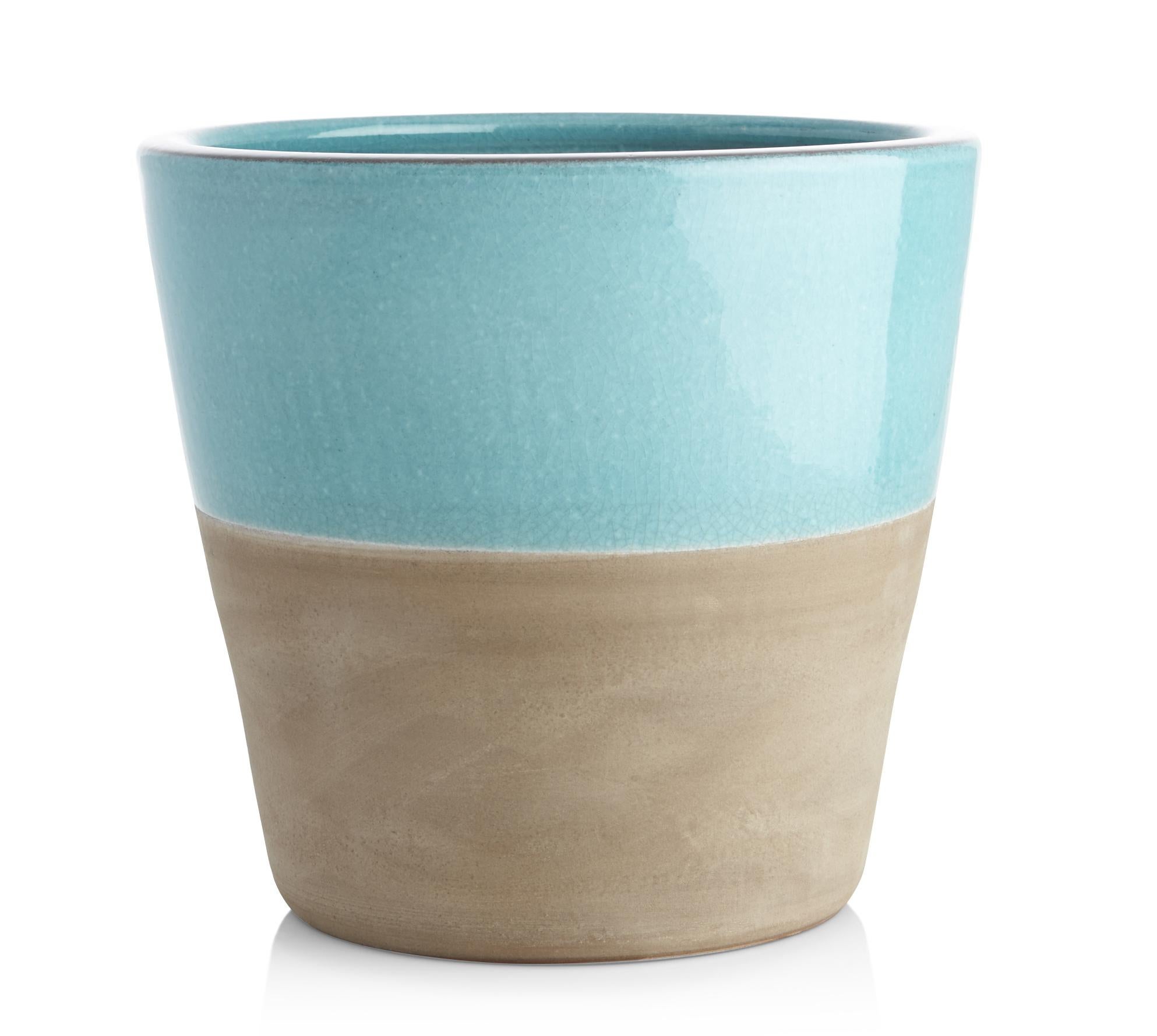 This affordable planter showcases two Brazilian design elements: natural colored terra cotta topped with a bold injection of aqua through the glaze